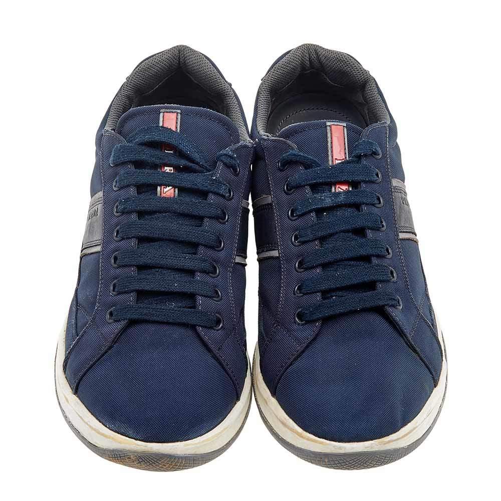 Prada Sport brings you these super stylish sneakers to elevate your appearance! They are crafted using navy-blue nylon into a sturdy low-top silhouette. They exhibit lace-up fastenings and black-tone hardware. Walk with style and confidence in these