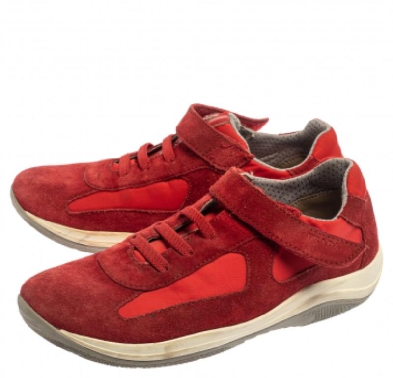These red sneakers from Prada Sport are just what you need to add to your style. They are crafted from suede and nylon in a low-top silhouette and feature round toes and lace-ups and velcro straps on the vamps. They offer a comfortable fit with