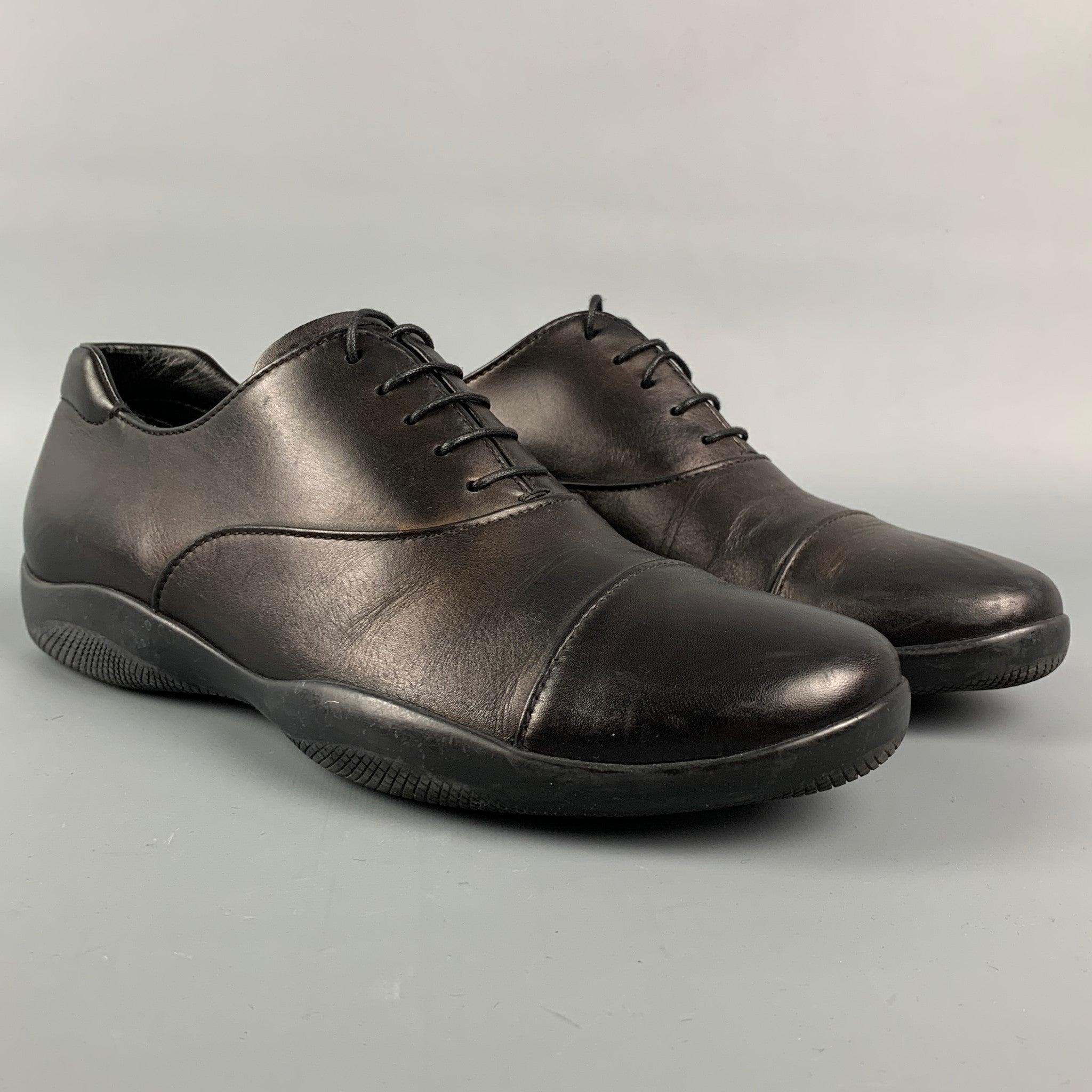PRADA SPORT shoes comes in a black leather featuring a cap toe. rubber sole, and a lace up closure.
Very Good
Pre-Owned Condition. 

Marked:   4 E 0770 5.5Outsole: 10.5 inches  x 4 inches 
  
  
 
Reference: 110957
Category: Lace Up Shoes
More