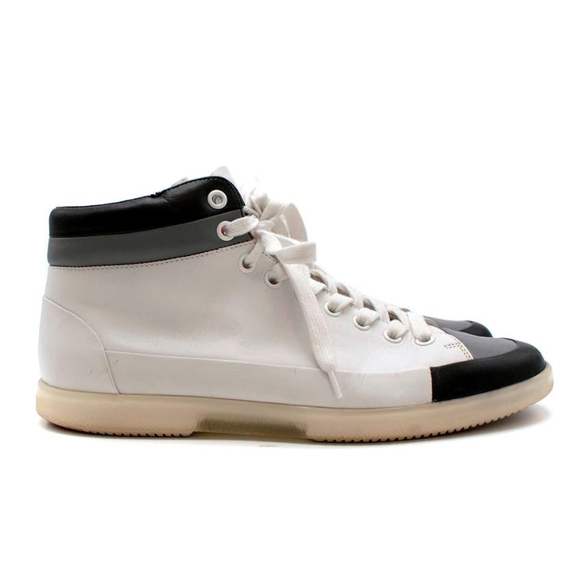 Prada Mens White Lace-up High Top Trainers 

- Round toe shape
- Soft structured leather in white with black & grey toe caps 
- Chunky white laces
- High top length with black padded leather around the ankles
- Red Prada label on the tongue
- Clear