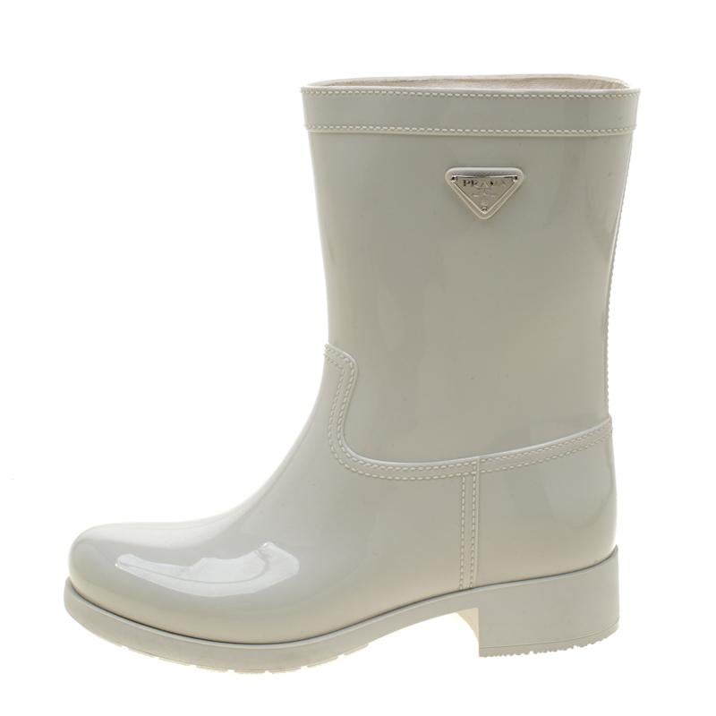 Enjoy the rain in style with these rain boots by Prada. Made from PVC, these cool white boots feature stitch detailed design and the Prada logo plaque in silver-tone. The interior is lined in fabric.

Includes:Original Dustbag
