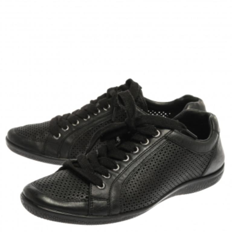 These Prada Sports low top sneakers are the embodiment of style and comfort. Rendered in a classic black color and crafted with perforated leather, these impressive sneakers are accented with lace-ups and the brand label on the tongue. They are also