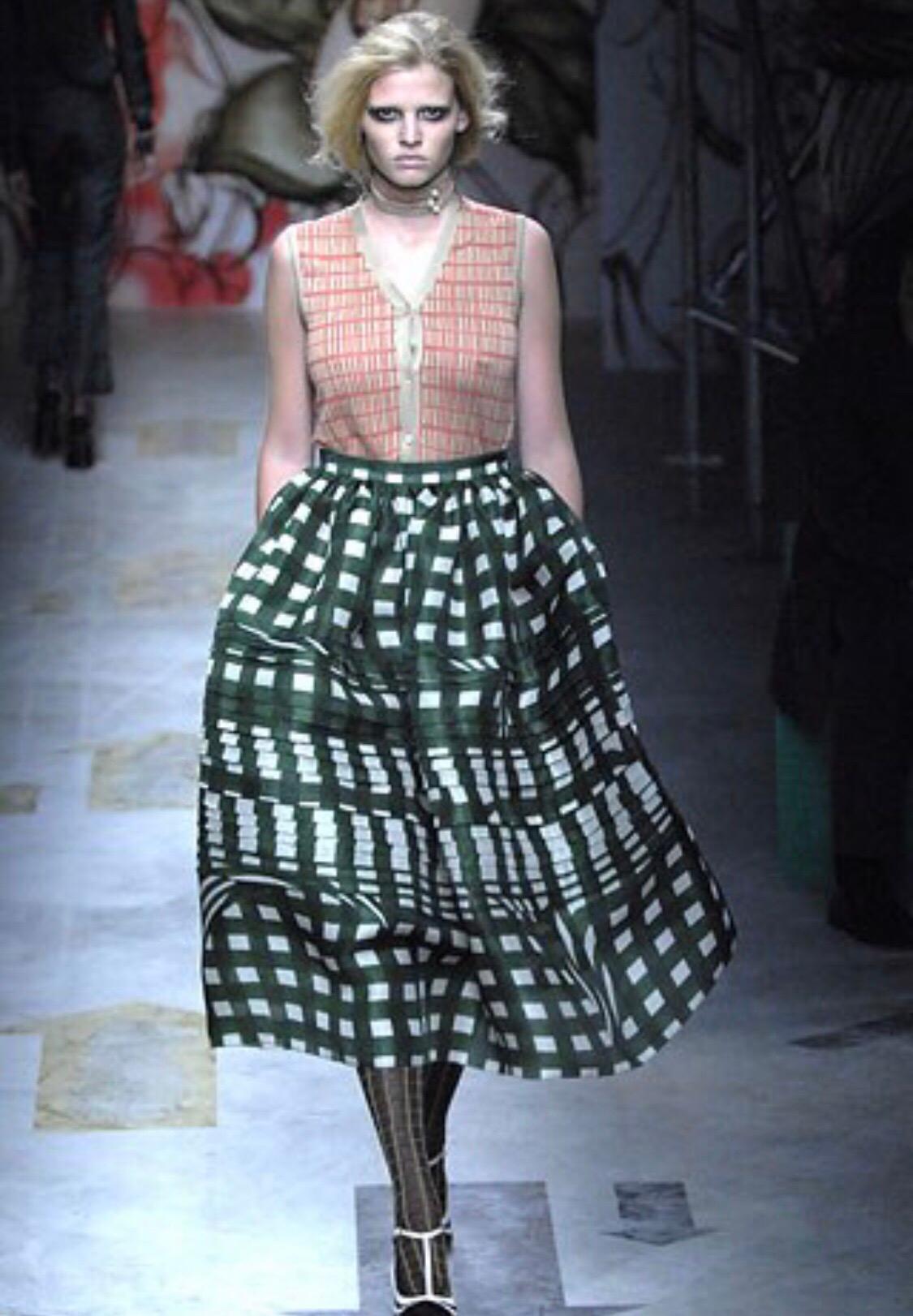 Rare PRADA Fairy Collection Spring 2008 green and white silk A - Line runway skirt! Features vibrant green and white checkered brushstroke print throughout, with palm leaves sporadically printed throughout. Prada logo discreetly printed throughout.