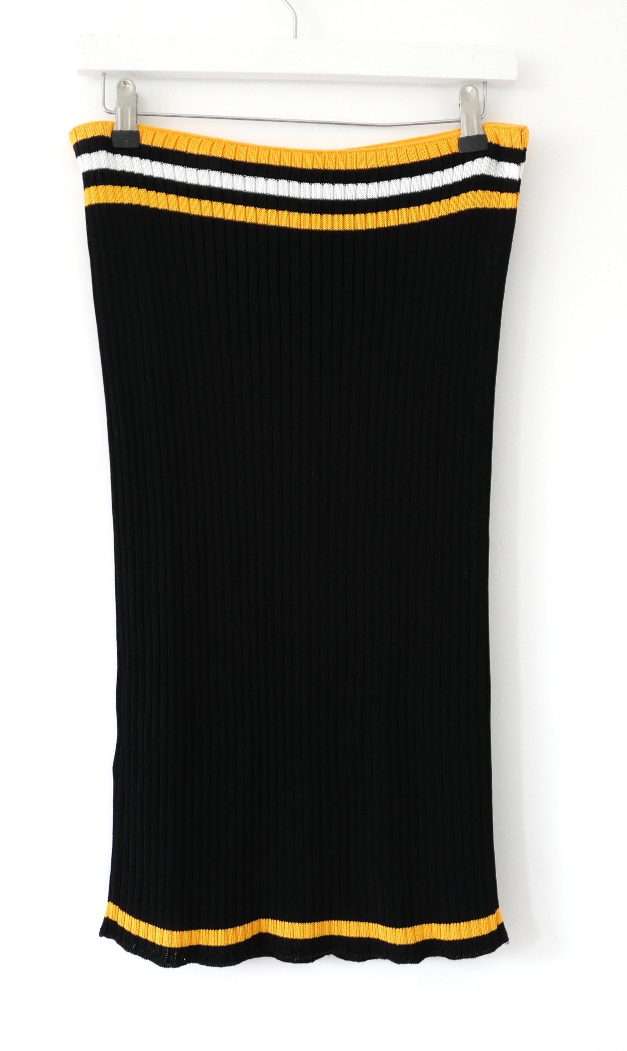 Super cool archival Prada ribbed knit skirt from the Spring 2014 collection. Unworn. Made from super stretchy black viscose knit with yellow and white contrast stripes, it has a  body-con silhouette with elasticated waistband. Slips on. Size