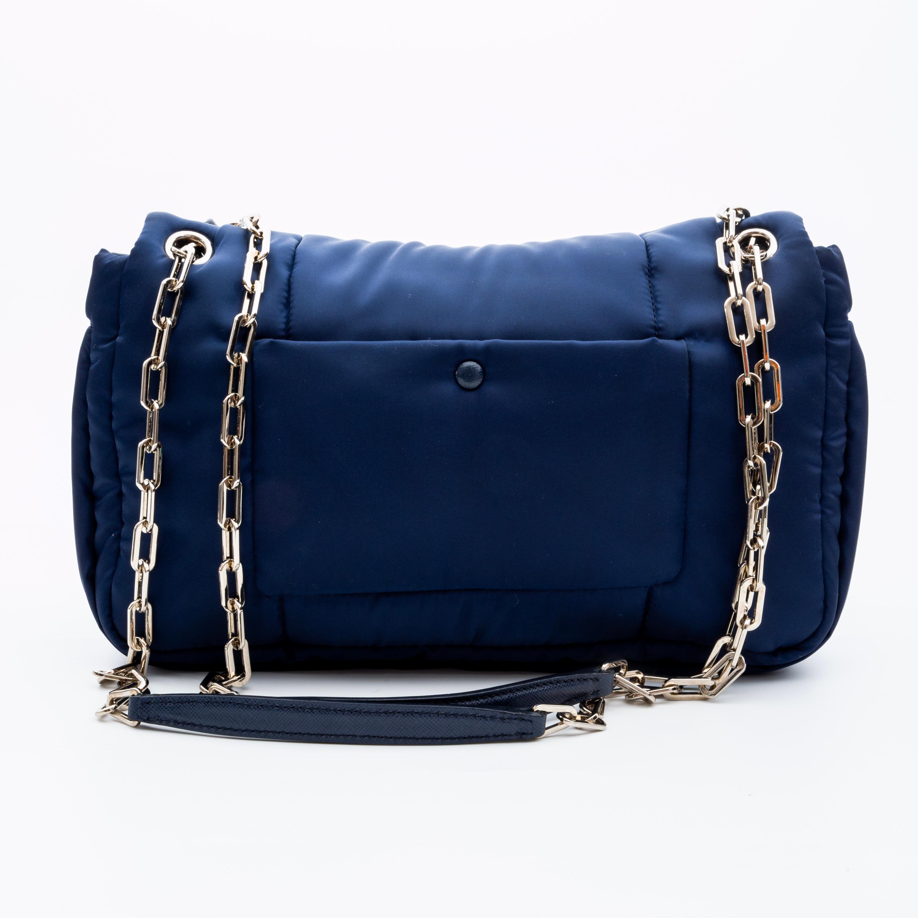 COLOR: Navy blue
MATERIAL: Nylon
ITEM CODE: 25
MEASURES: H 7” x L 11” x D 3”
DROP: 11.5” (both straps)
DROP: 22” (single strap)
COMES WITH: Dust bag and box, certificate from Real Authentication
CONDITION: Like new. Pristine.

Made in Italy
