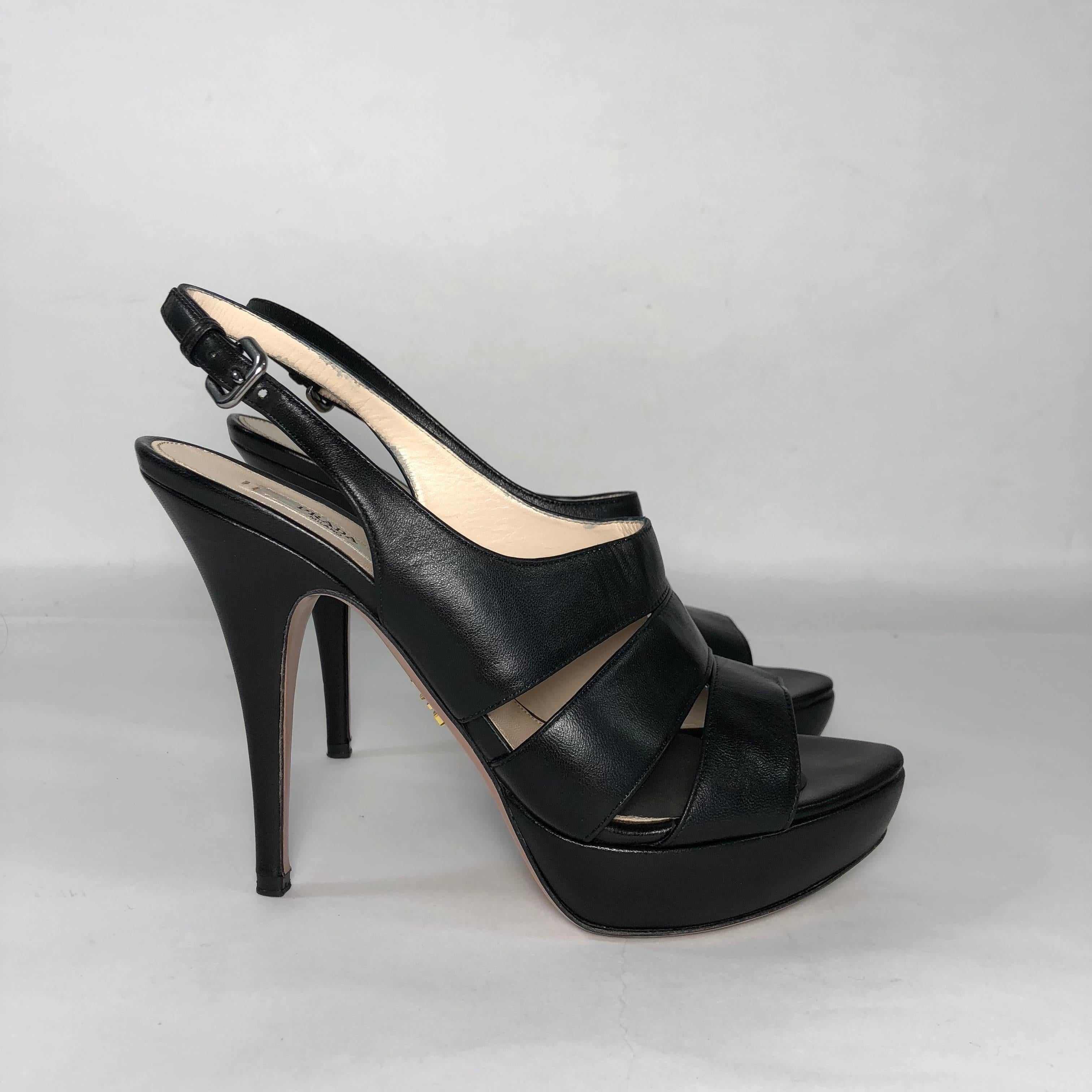 MODEL - Prada Stiletto Platform Sling Back Peep Toe in Black Leather

CONDITION - Gently worn.

SKU - 2162

ORIGINAL RETAIL PRICE - 895 + tax

SIZE - Euro 39.5 or US 9 (Medium)

MATERIAL - Leather

HEEL HEIGHT - 5 inches

INTERIOR SOLE MEASURE -