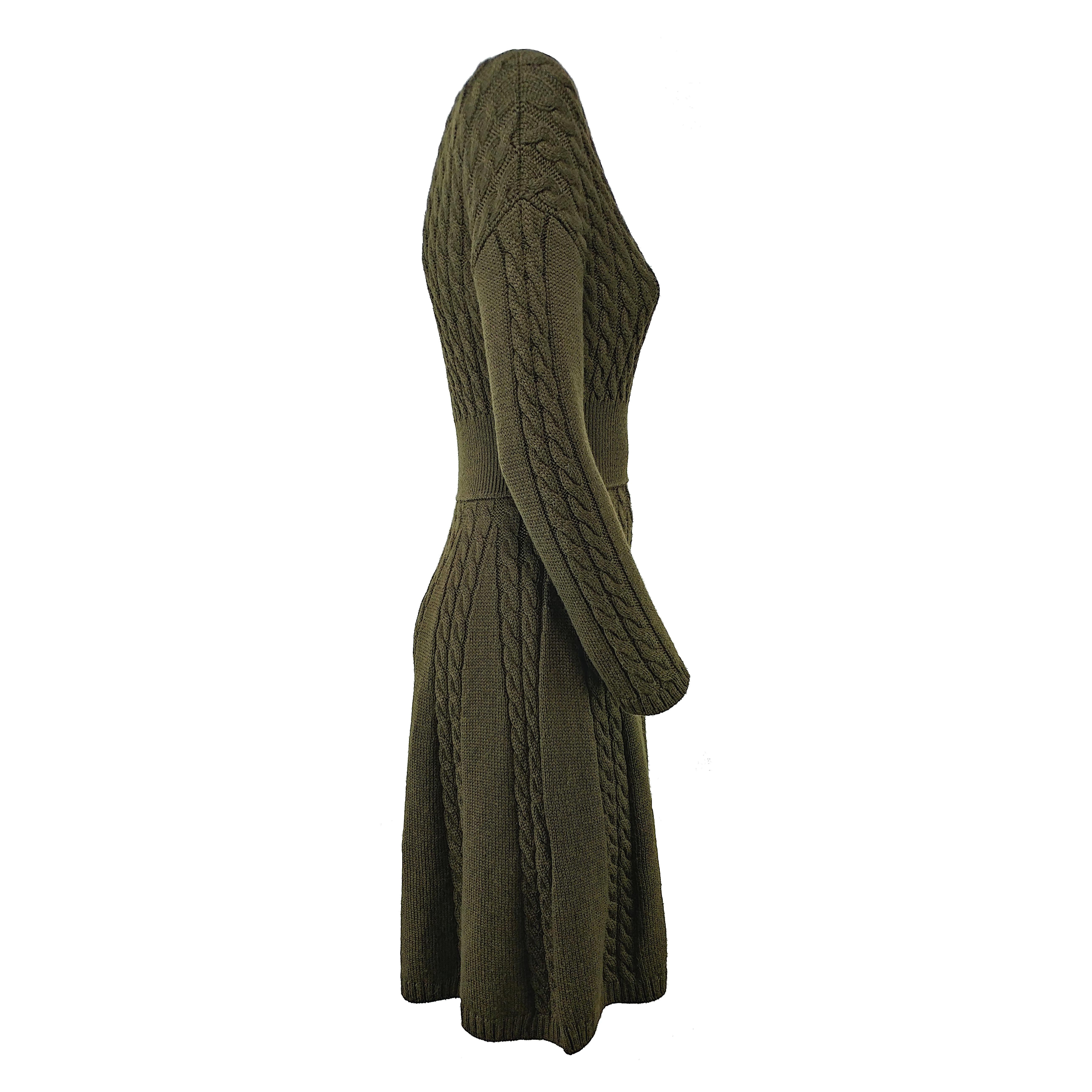 Following Prada's sleek yet iconic style, this long-sleeve dress arrives in an olive green hue. Crafted in Italy from pure wool, its top elegantly clings to the body, before falling with a draped midi skirt. It has been worn only a few times and it