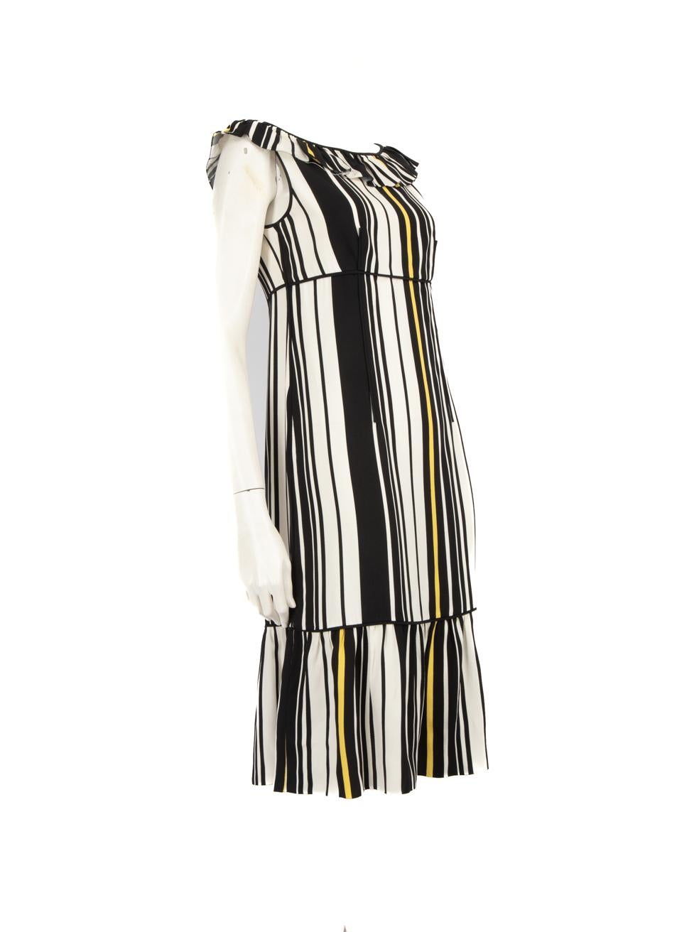 CONDITION is Very good. Minimal wear to the dress is evident. One pluck to the weave on the left side of the neckline ruffle. Fraying to the hemline and hem of the neckline ruffle detailing. On the lower left side there is a small hole and a small