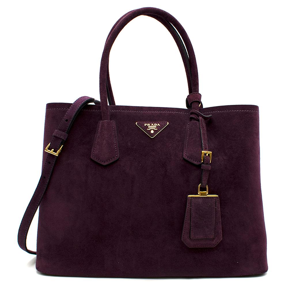 Prada Suede Medium Dark Purple Double-Pocket Tote Bag

-Golden hardware.
-Rolled tote handles with keeper.
-Removable adjustable shoulder strap.
-Open top.
-Expandable snap sides.
-Hanging ID tag.
-Leather triangle with metal logo lettering.
-Center