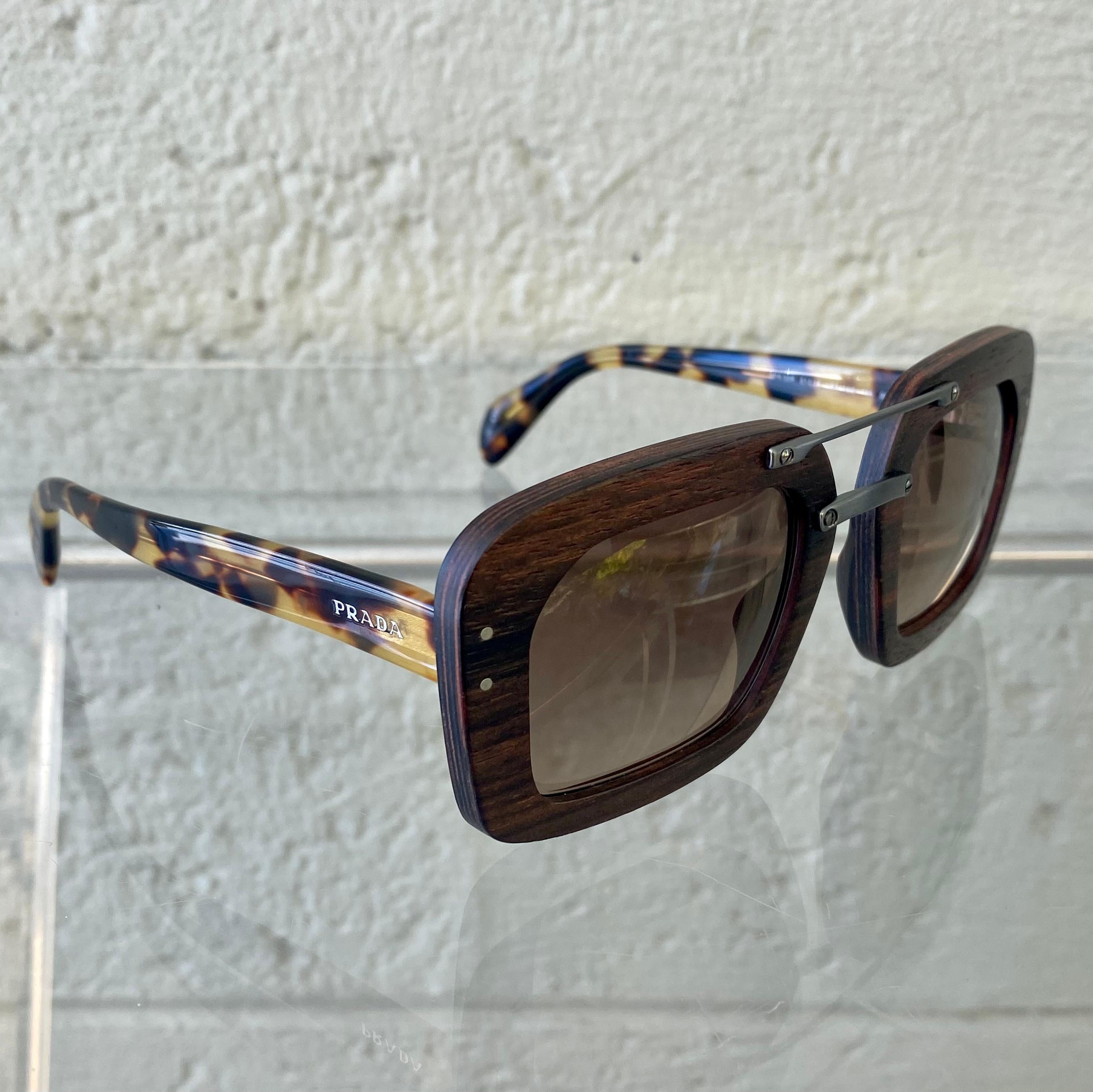 Classic and Timeless Prada sunglasses. Made from Acetate and Polycarbonate , these Gucci sunglasses are durable and trendy. The lenses matches well with the Tortoiseshell frames, a great combination that will keep you looking chic and stylish!