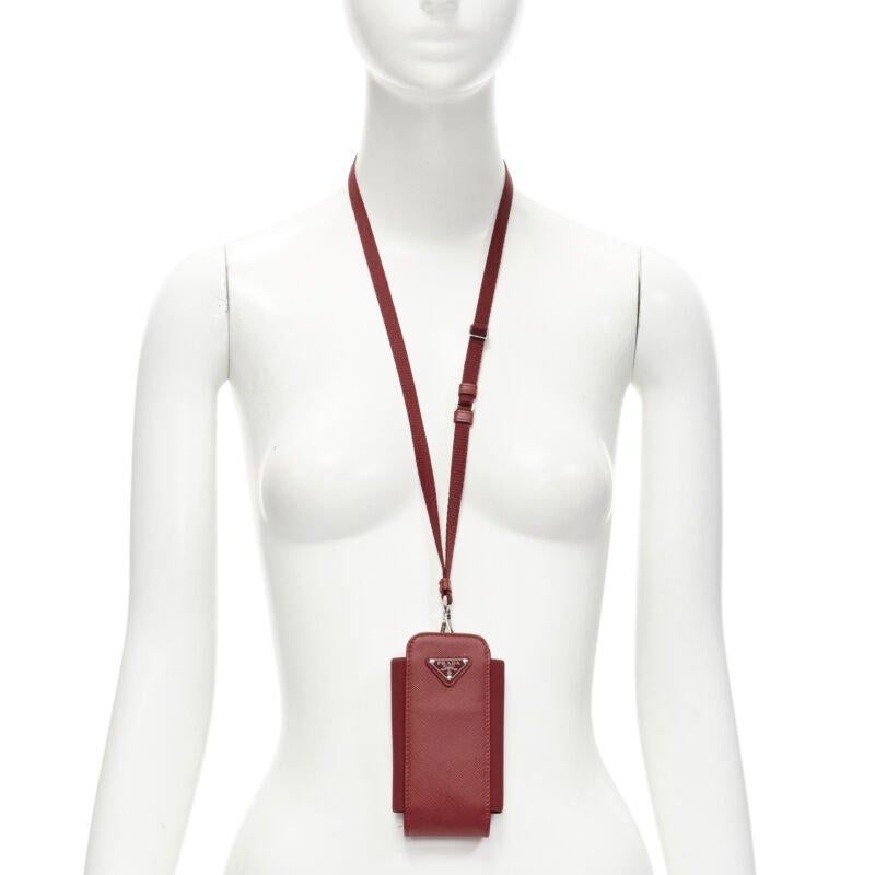 PRADA Symbole Triangle logo saffiano leather phone pouch lanyard bag red
Reference: TGAS/C01602
Brand: Prada
Designer: Miuccia Prada
Material: Leather, Nylon
Color: Red
Pattern: Solid
Closure: Elasticated
Extra Details: This will fit various sizes
