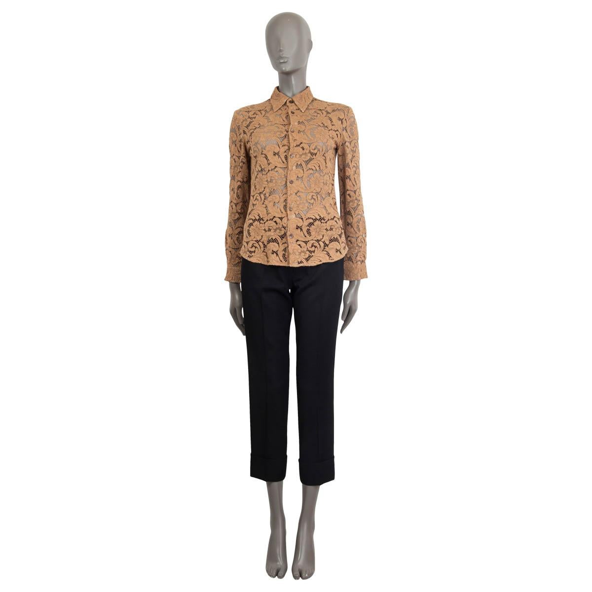 100% authentic Prada long-sleeve semi-sheer lace shirt in light brown viscose blend (assumed cause tag is missing). Features buttoned cuffs and a point collar. Opens with buttons on the front. Unlined. One button is broken, otherwise in excellent