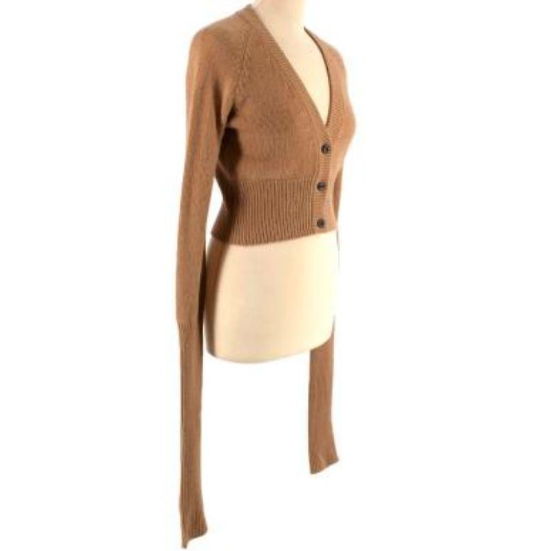 Prada Tan Cashmere Cropped Cardigan

-Ribbed neckline, hem & Cuffs 
-V-neck 
-Extra long sleeves 
-Cropped fit 
-Button fastening along the front 

Material: 

No care label but we believe it to be a Cashmere blend, please refer to images for