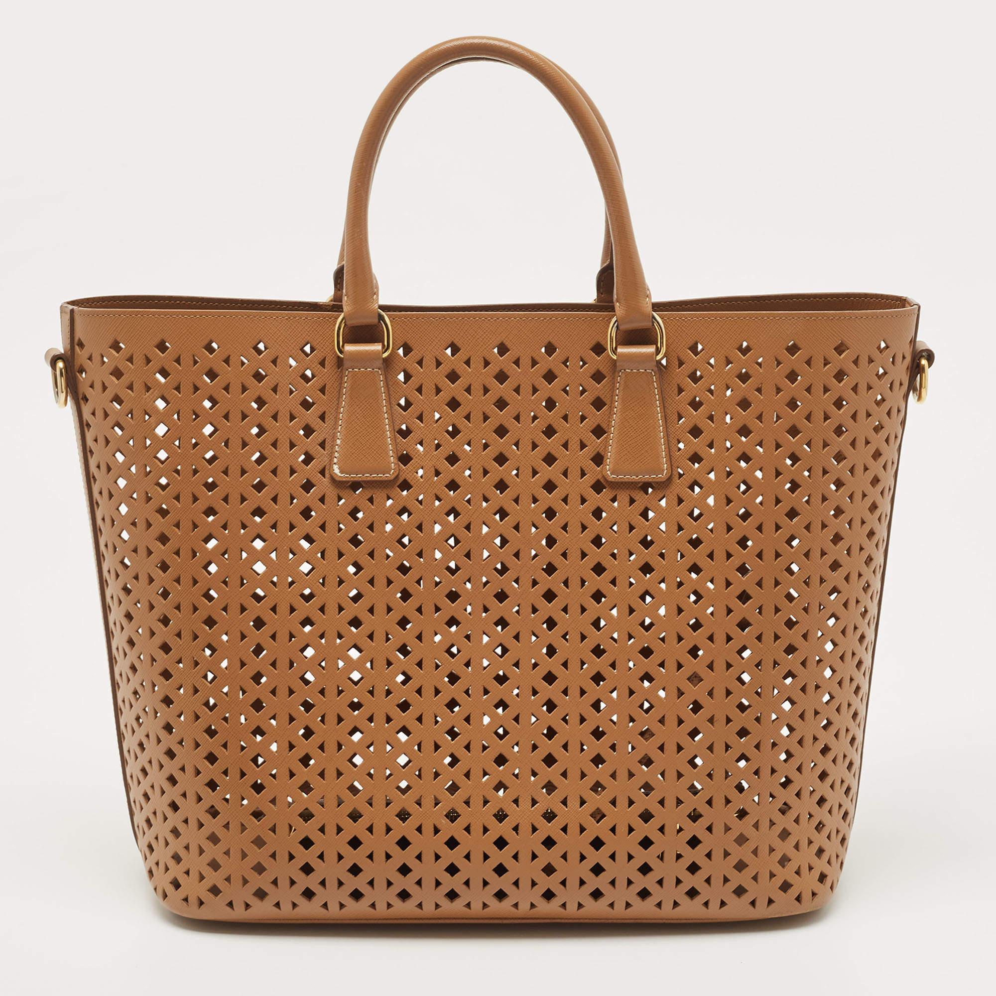 Thoughtful details, high quality, and everyday convenience mark this Prada Saffiano leather bag for women. The bag is sewn with skill to deliver a refined look and an impeccable finish.

Includes: Detachable Strap, Detachable Zip Pouch