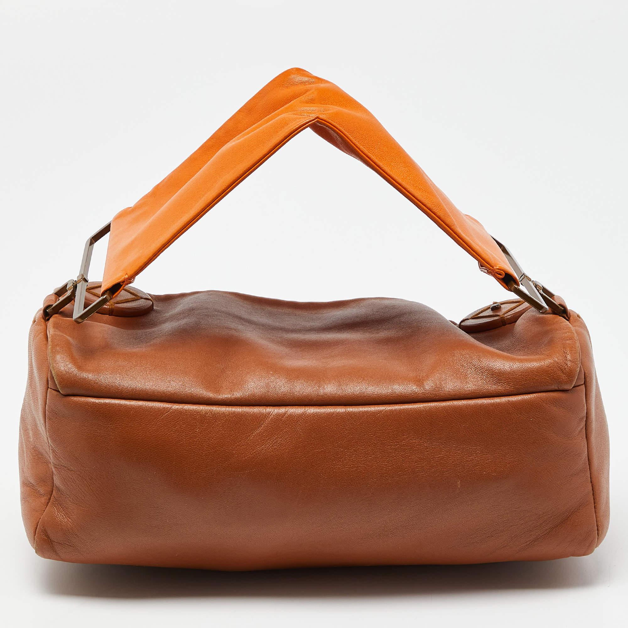This satchel is rendered in the finest quality materials into an elegant design. Versatile and functional, it is well-sized for your daily use.

Includes: Original Dustbag
