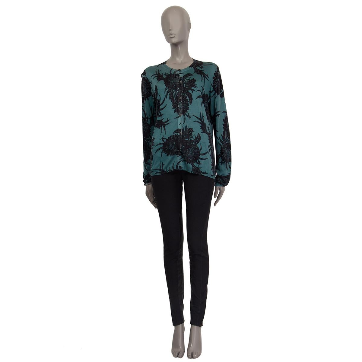 100% authentic Prada button-front crewneck caridigan in teal silk (content tag is missing) with black floral print. Has been worn and is in excellent condition.

Measurements
Tag Size	44
Size	L
Shoulder Width	41cm (16in)
Bust	110cm (42.9in) to 120cm