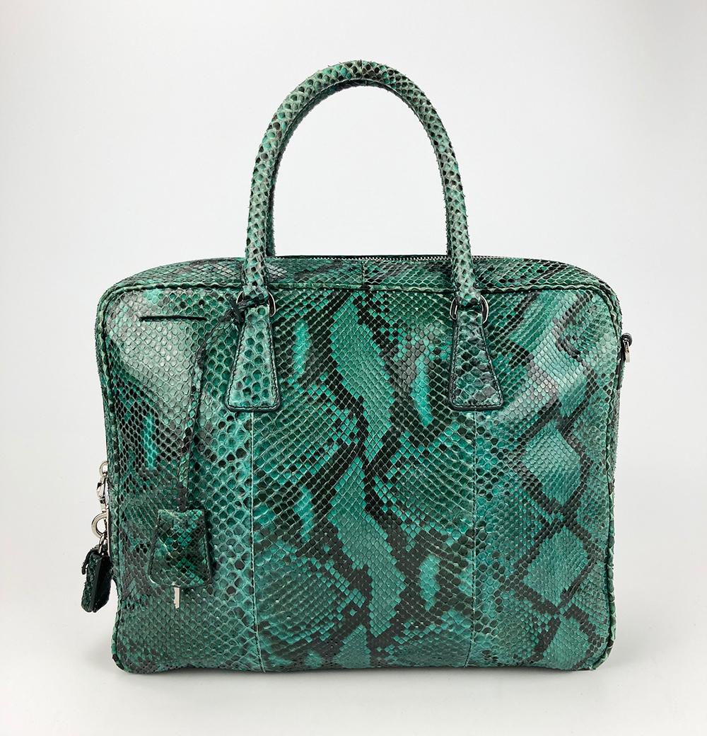 rare Prada Teal Snakeskin Python Top Handle Tote in excellent condition. pretty teal/turquoise python snakeskin exterior trimmed with silver hardware. Matching removable shoulder strap. Top zip closure opens to a beige leather lining with 1 zip and