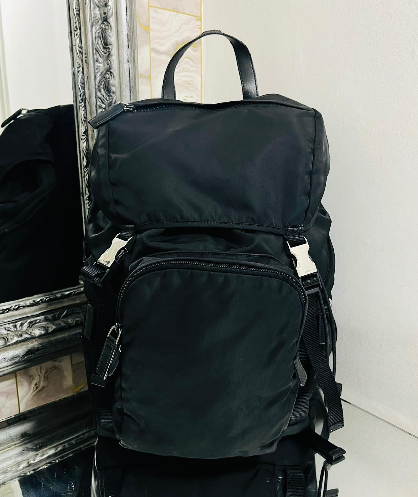 Prada Tessuto Montagna Backpack

Black backpack designed with double 'Prada' engraved silver buckle to the front.

Featuring adjustable straps, zipped compartment to the centre and side zip pockets.

Flap front closure leading to top cinch cord that