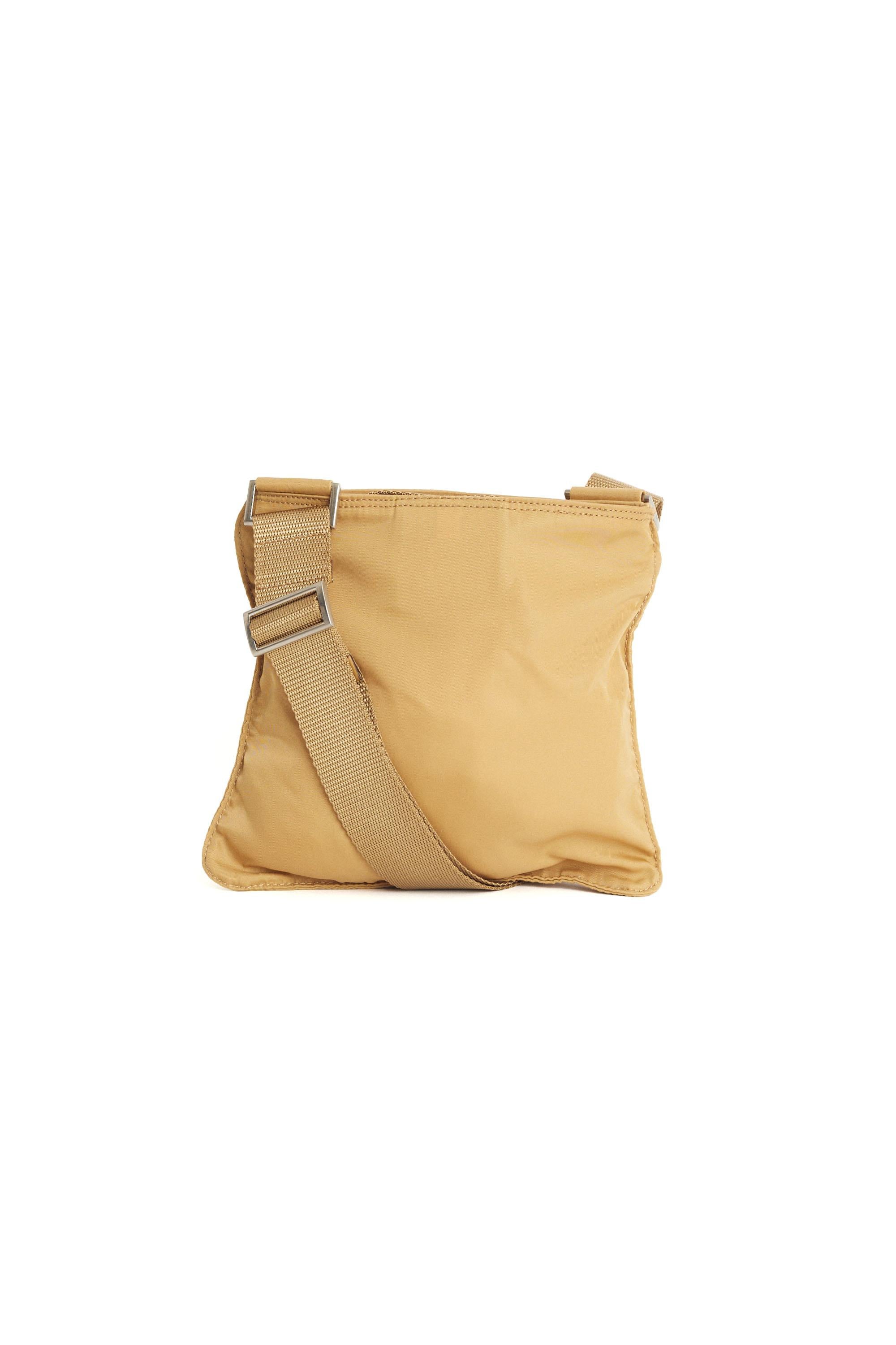 Nordic Poetry is excited to present this Prada Tessuto nylon camel crossbody bag. Features Prada hardware, two compartments and adjustable strap. 
Authenticity guaranteed.

Fabric: Nylon
Dustbag: No
Serial Number: 39
Measurements: Length: 8 inches,