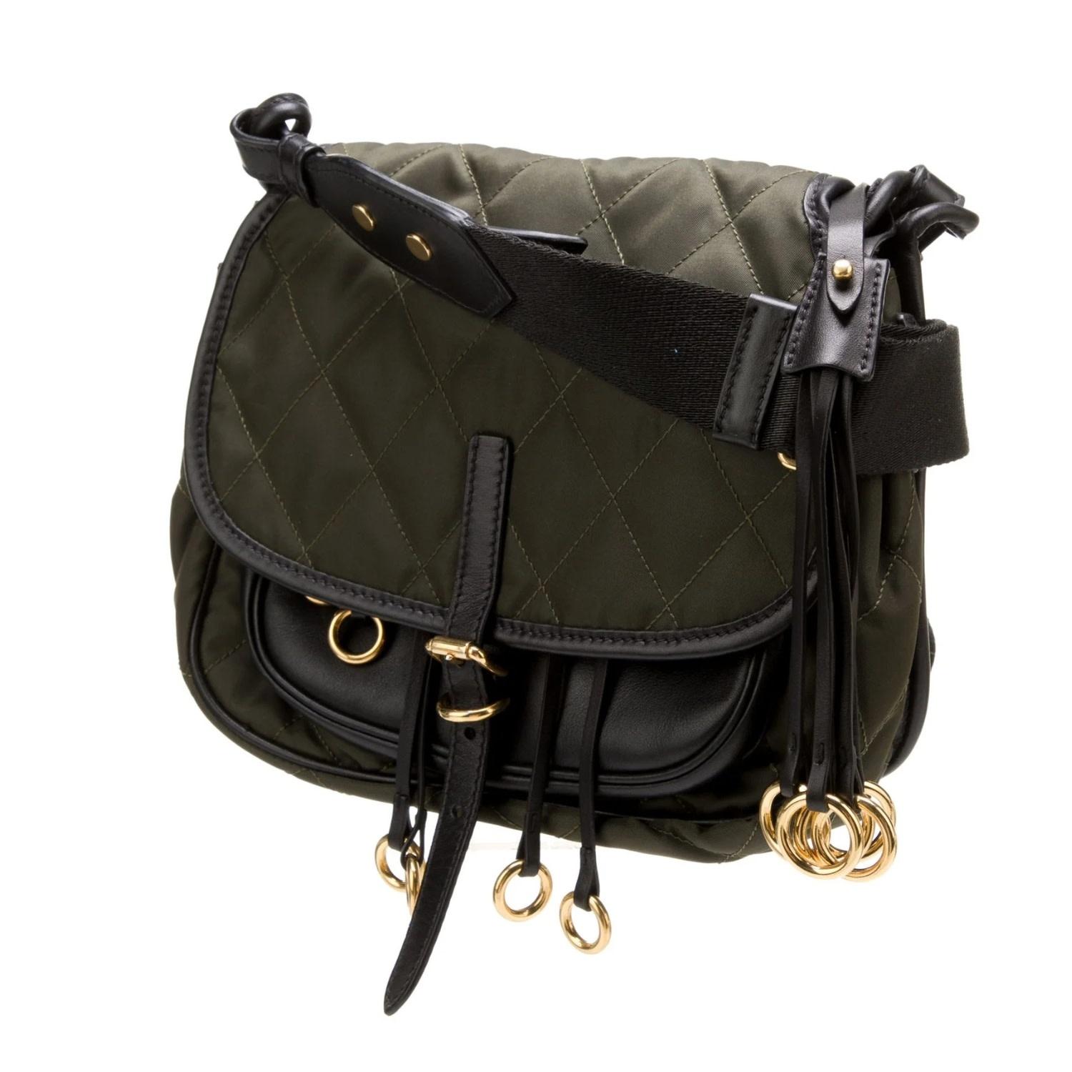 This Prada messenger bag is made from green Tessuto nylon and features leather trim embellishments and gold-tone hardware. The bag is designed with a single adjustable shoulder strap for versatile wear. The interior is lined with logo jacquard