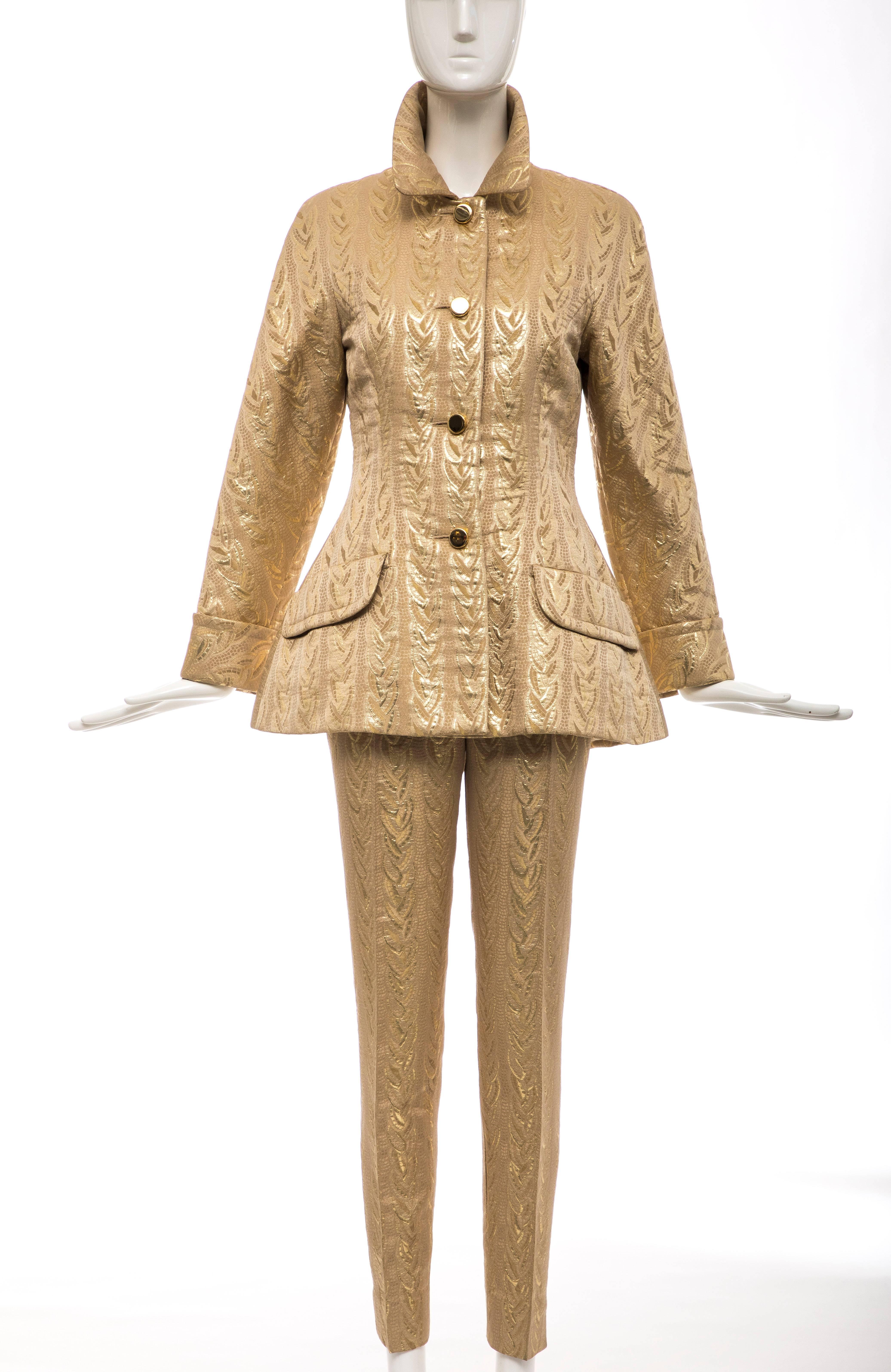 Prada, Autumn/Winter 1992, three piece gold brocade ensemble. The button front jacket has two front pockets, self belt, cuffed sleeves and fully lined. The slim leg pant has side zip and button closure and short skirt has side zip, button closure