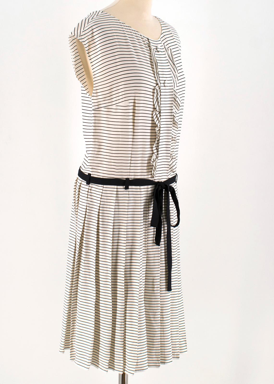 Prada Tie-Waist Striped Crepe Dress

-Cream and black striped, mid-weight crepe 
-Round neck, capped sleeves 
-Decorative placket and two buttons, ruffle-trimmed edges 
-Drop waist, black crepe waist tie 
-Pleated skirt 
-Centre-back concealed zip