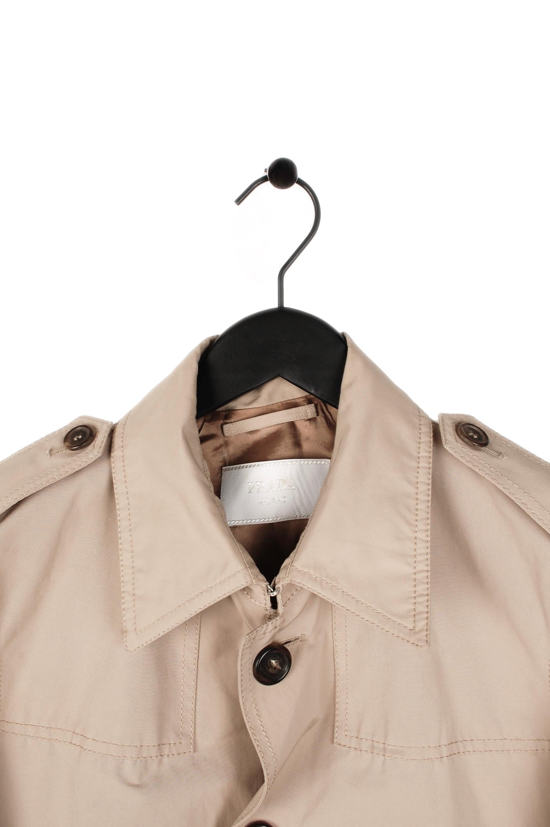 Item for sale is 100% genuine Prada Trench Belted Coat Belted (S037)
Color: Sand
(An actual color may a bit vary due to individual computer screen interpretation)
Material: 65% cotton, 35% silk
Tag size: 48IT(M) 
This coat is great quality item.