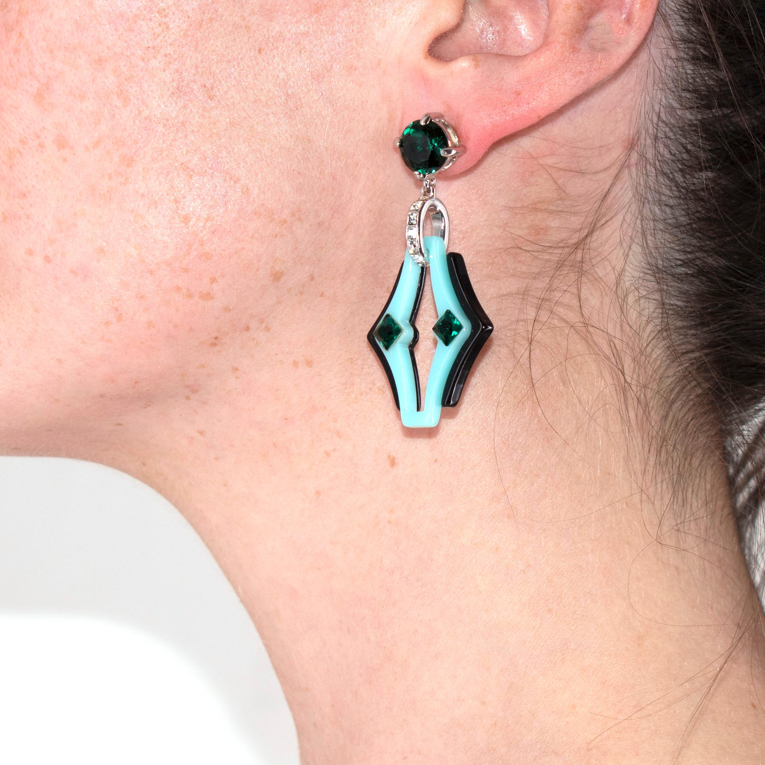 Prada Turquoise Sculpted Acetate & Crystal Drop Earrings

- Shaped as diamonds with abstract cutouts, crafted in a black and turquoise acetate, finished with a green crystal stud
- Post fastening, for pierced ears 

Measurements:
5cm length 
3cm