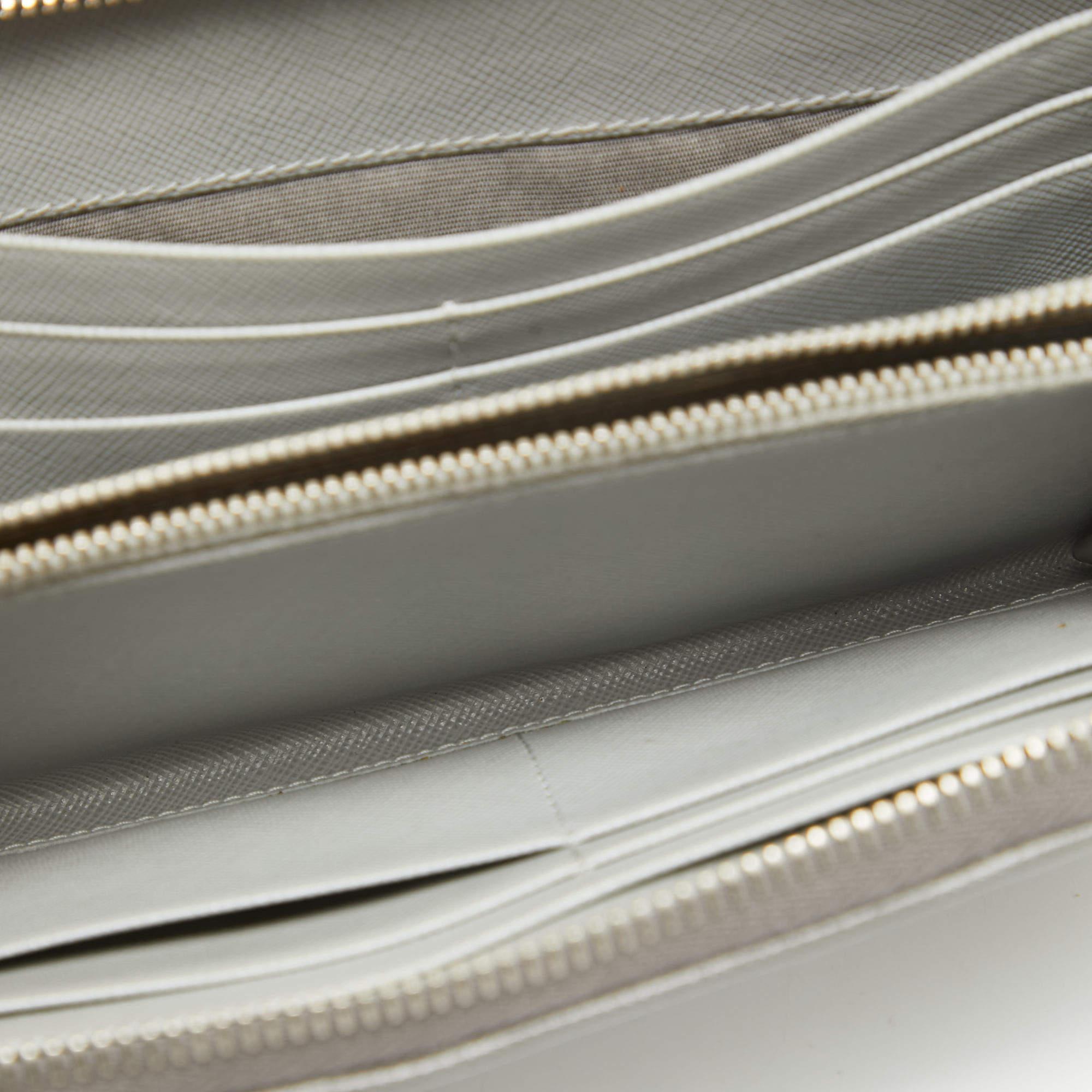 This Prada Saffiano leather wallet is carefully crafted to offer you a luxurious accessory you will cherish. It is marked by high quality and enduring appeal. Invest in it today