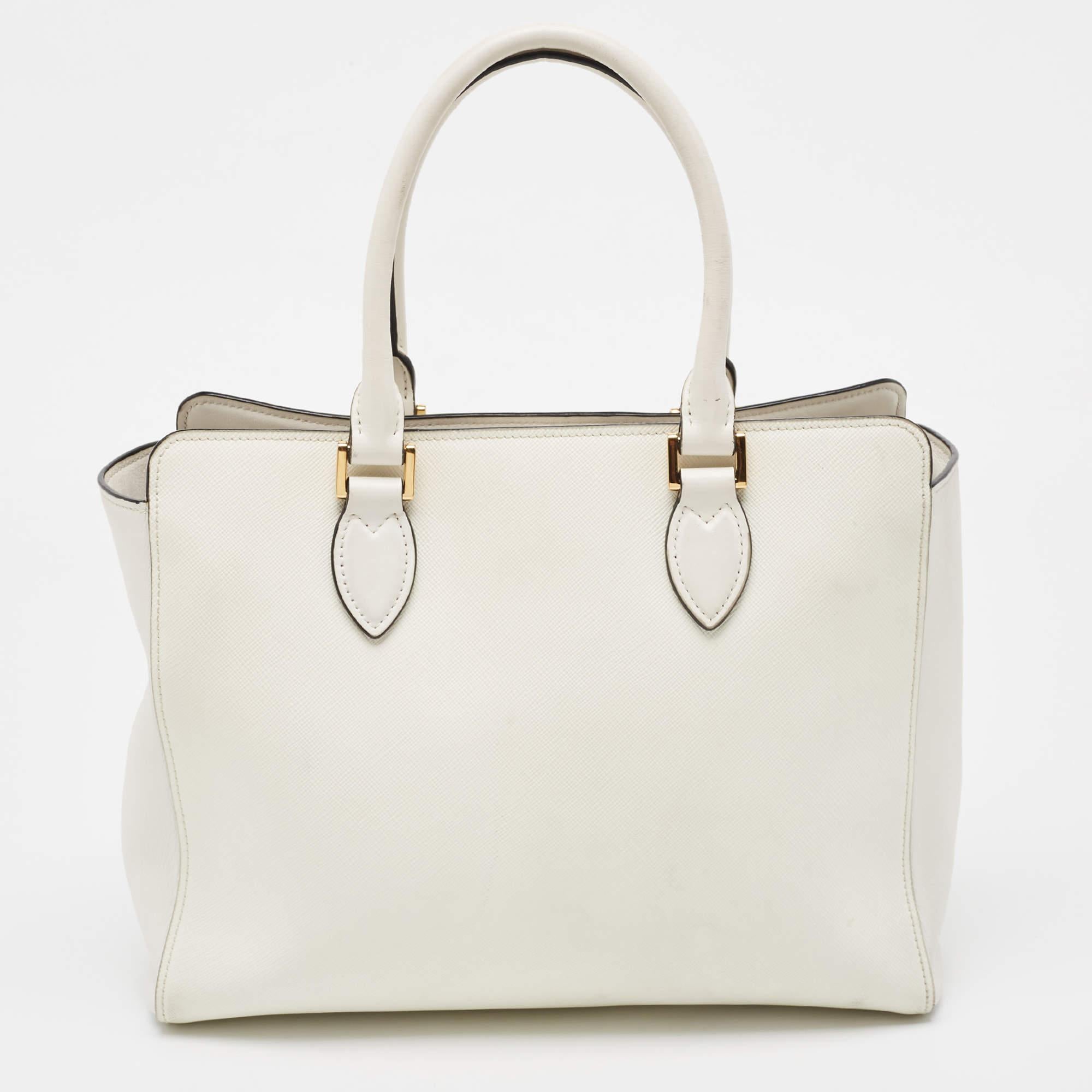 Striking a beautiful balance between essentiality and opulence, this tote from the House of Prada ensures that your handbag requirements are taken care of. It is equipped with practical features for all-day ease.

Includes: Authenticity Card, Info