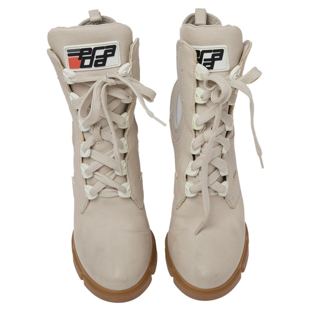 Step out looking like a complete fashionista with these Combat boots. Made by the House of Prada, they will certainly give your feet a fine touch. The structure of these boots is made using white leather and neoprene material. These Prada boots are