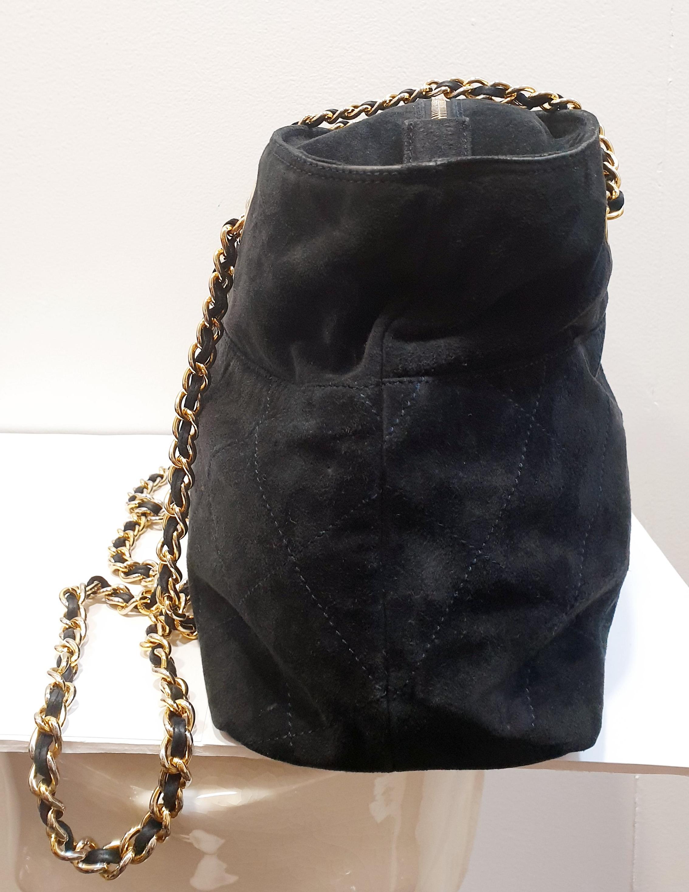 black suede bag with gold chain