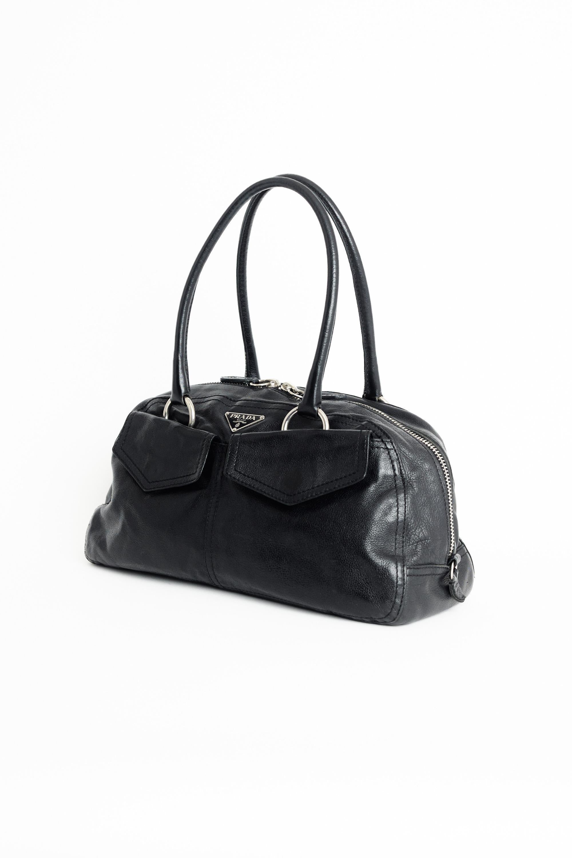 Nordic Poetry is excited to present this iconic Prada 1990’s bowler black leather bag. Features Prada logo hardware, outer pockets, double zip and inside zip back closure. In excellent vintage condition. Authenticity guaranteed.

Fabric: