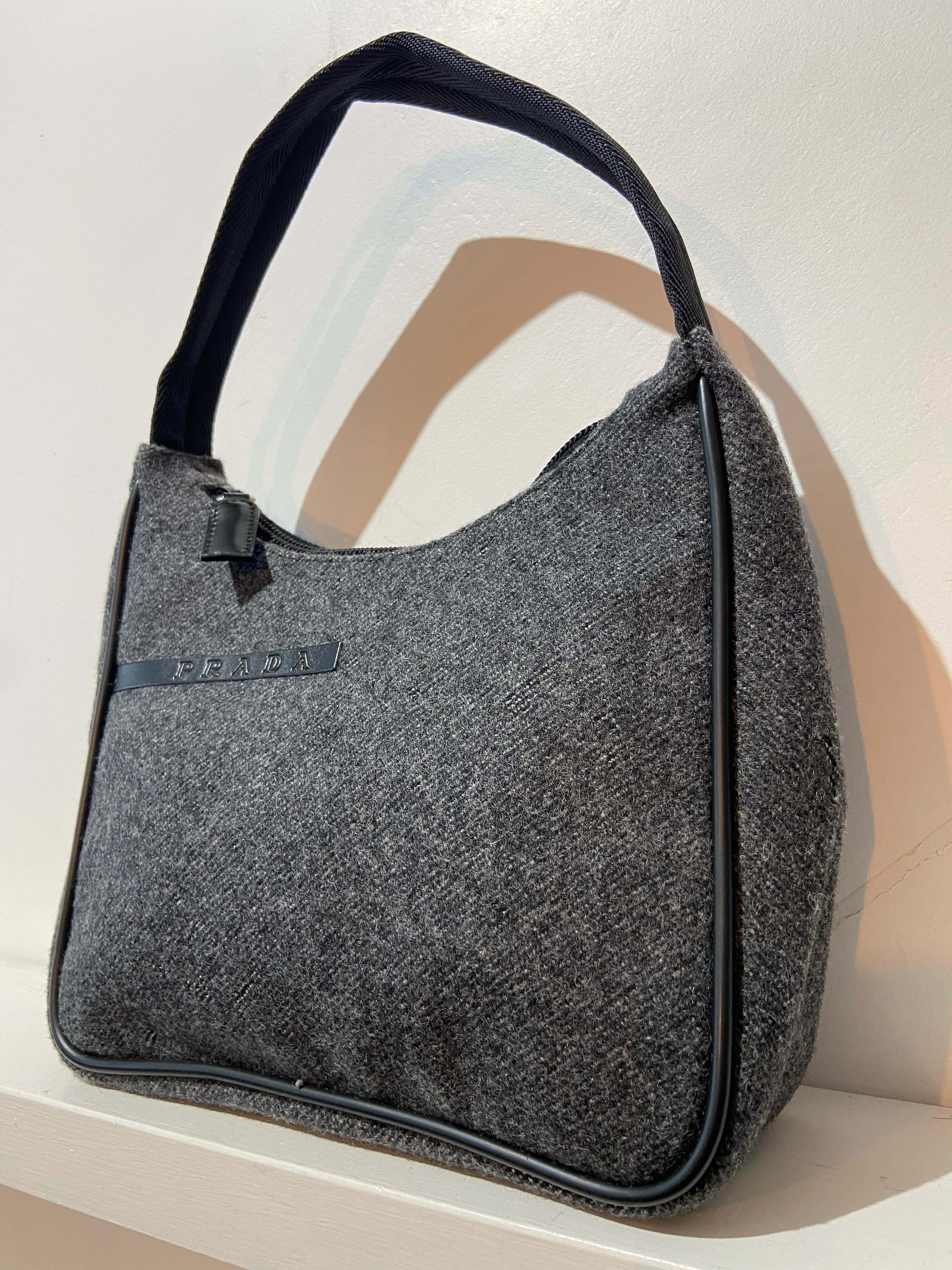 Prada from 1999 collection dark grey wool  hobo bag. Features a keychain and zip closure. Pre-loved, in excellent vintage condition.

Brand: Prada
Color: Grey
Hobo bag
Fabric: Wool,
Dustbag: No
Authentication card: No
Serial number: