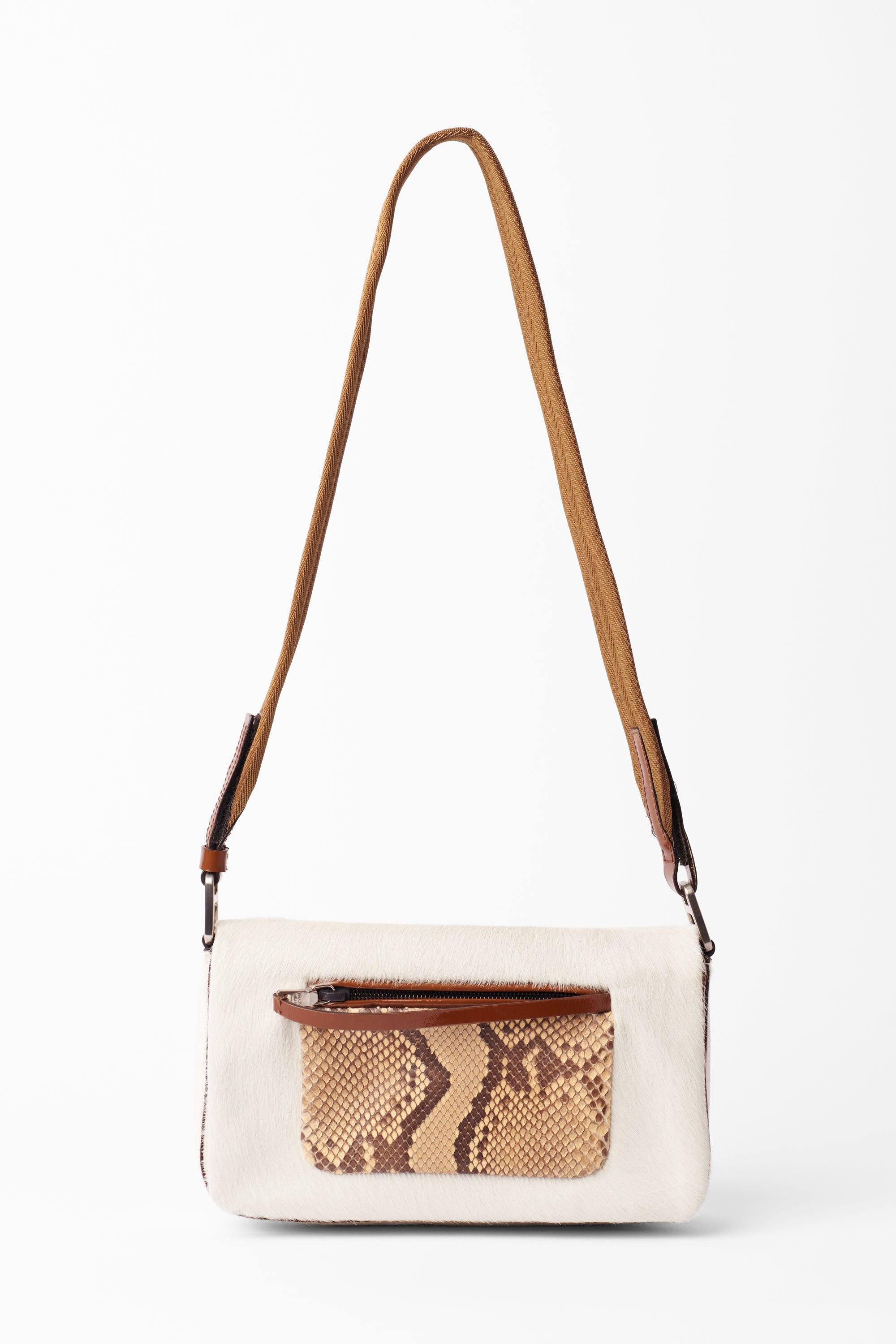 Prada 1999 tan fur bag with snakeskin leather orange pocket. Features shoulder length strap, velcro fastening, back pocket and zip front pocket with inside zip pocket. In excellent condition.
Brand: Prada
Color: Tan
1999
Crossbody bag
Colour: Tan,