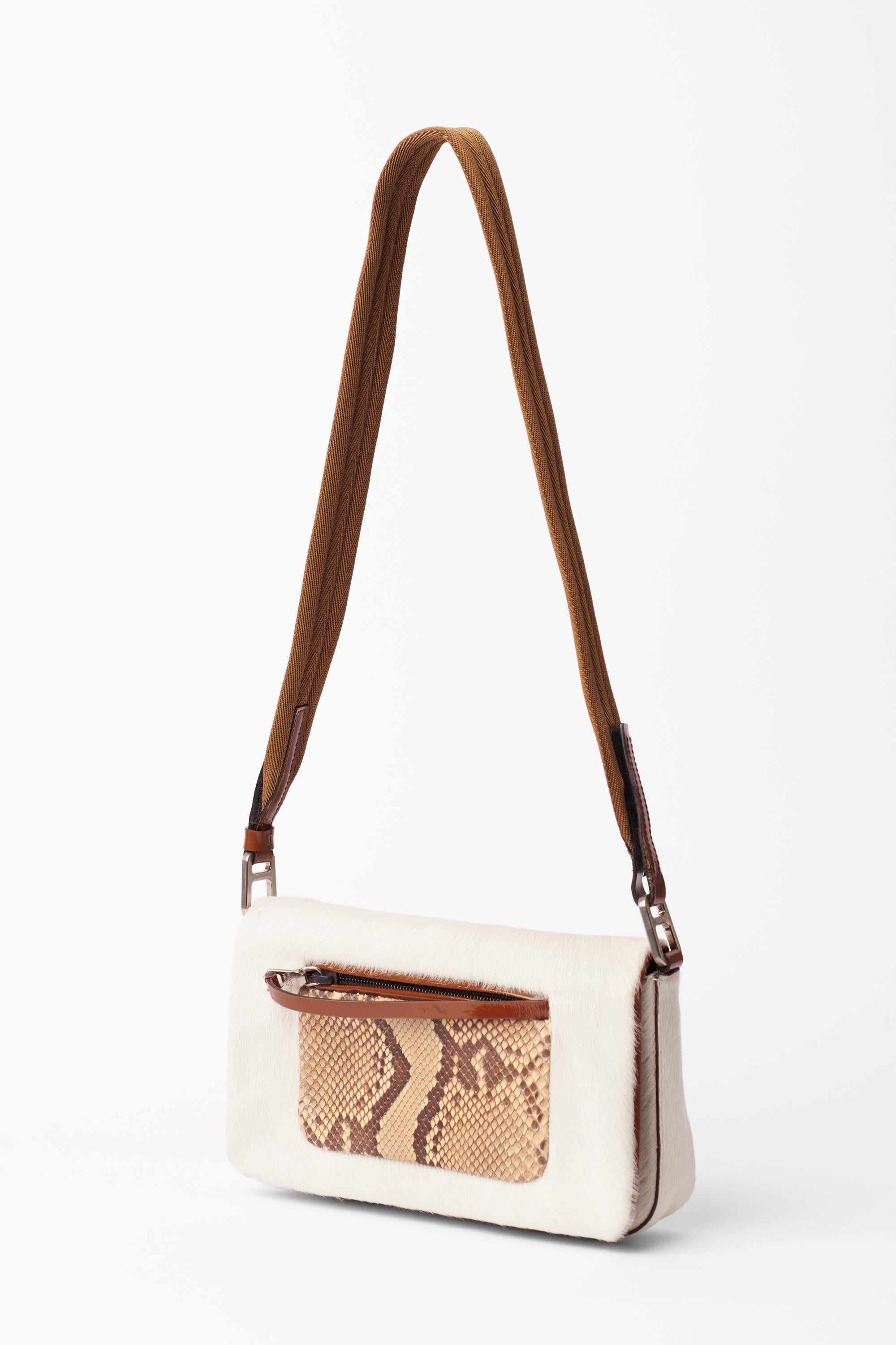Prada 1999 tan fur bag with snakeskin leather pocket. Features shoulder length strap, velcro fastening, back pocket and zip front pocket with inside zip pocket. In excellent condition.

Brand: Prada
Color: Cream
Material: Pony hair & Leather
Fabric: