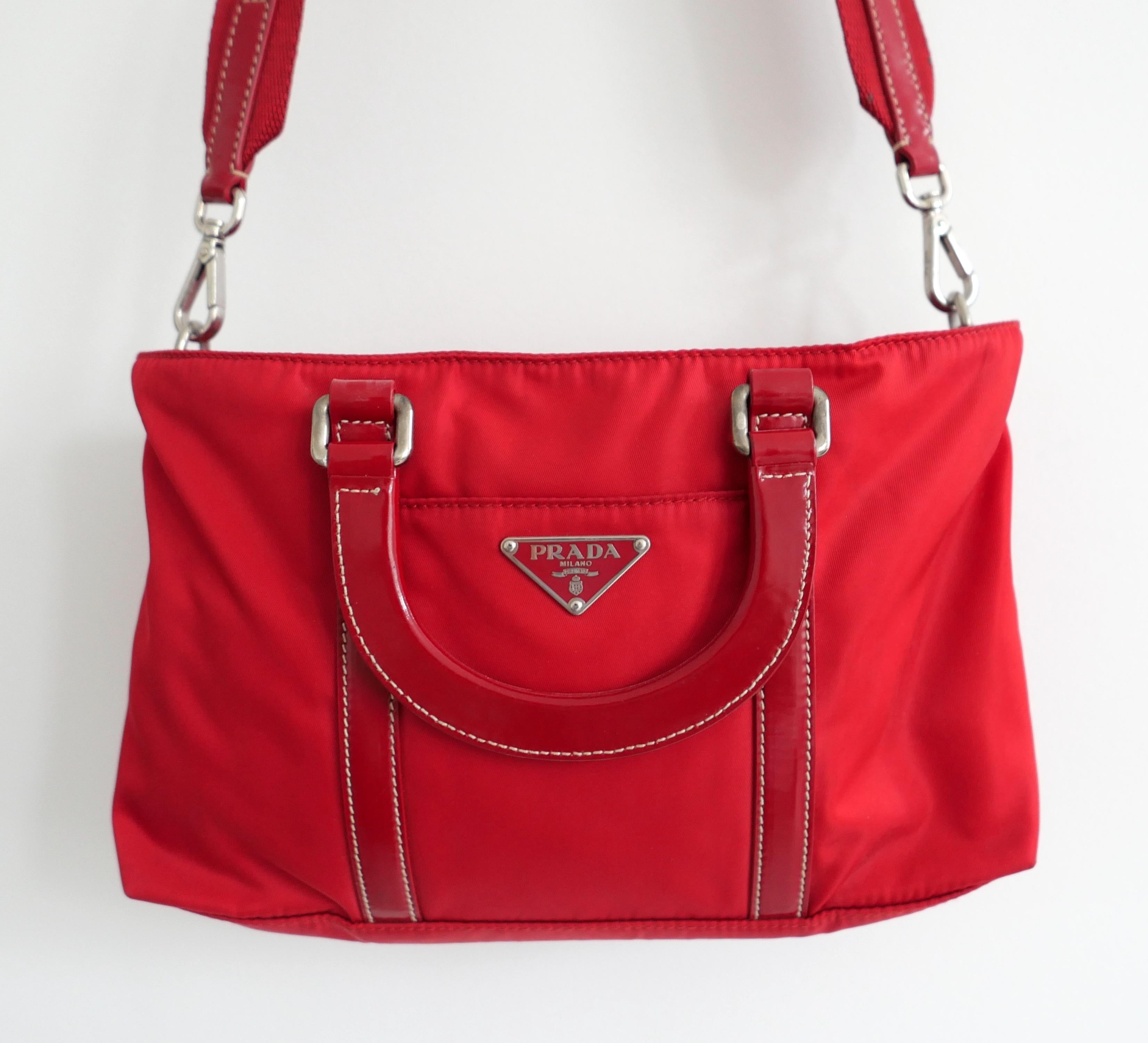 Rarest ever Prada vintage nylon bag from the Spring 2004 collection. I have never seen this model in this colour for sale before. Unworn with authenticity cards and dustbag. Made from bright red nylon and leather with removable leather trimmed,