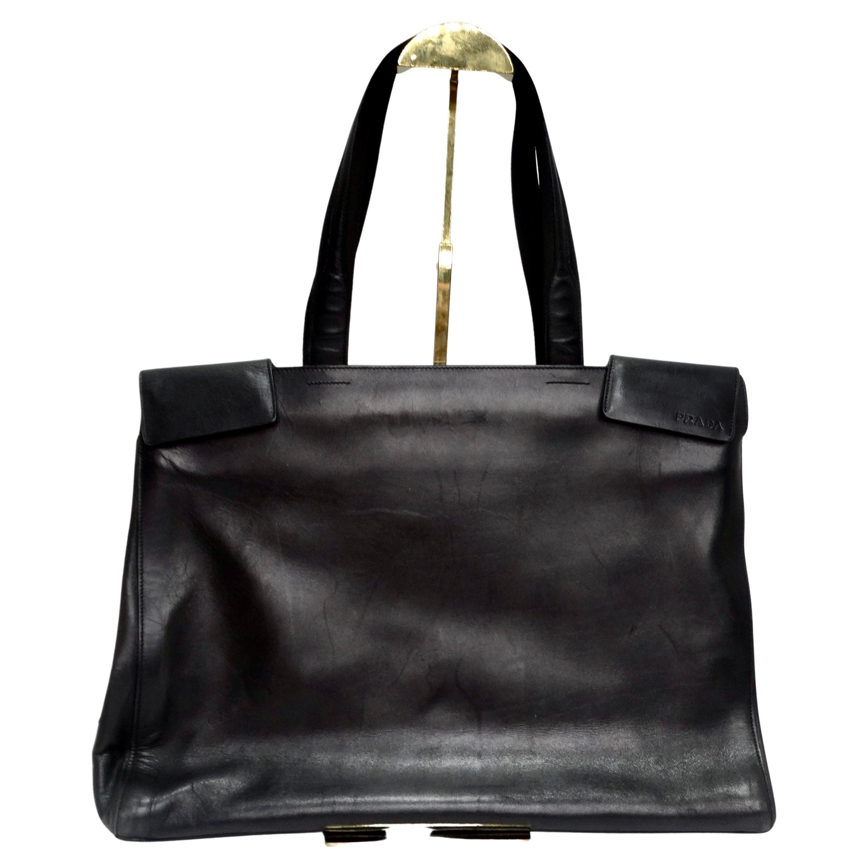 Introducing the Prada Vintage Black Leather Tote Bag: Your Timeless Travel and Work Companion!

Elevate your style with this classic Prada Vintage Black Leather Tote Bag, a true icon of luxury and sophistication. Crafted with precision and attention