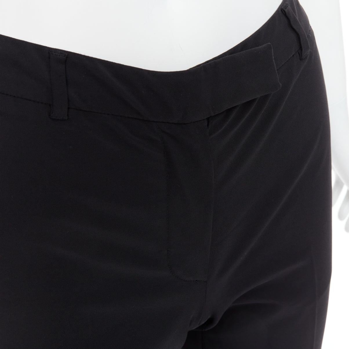 PRADA Vintage black magic tape front crop trouser  pants IT38 XS
Reference: LNKO/A02572
Brand: Prada
Designer: Miuccia Prada
Material: Polyester, Blend
Color: Black
Pattern: Solid
Closure: Zip Fly
Extra Details: Magic tape closure.
Made in: