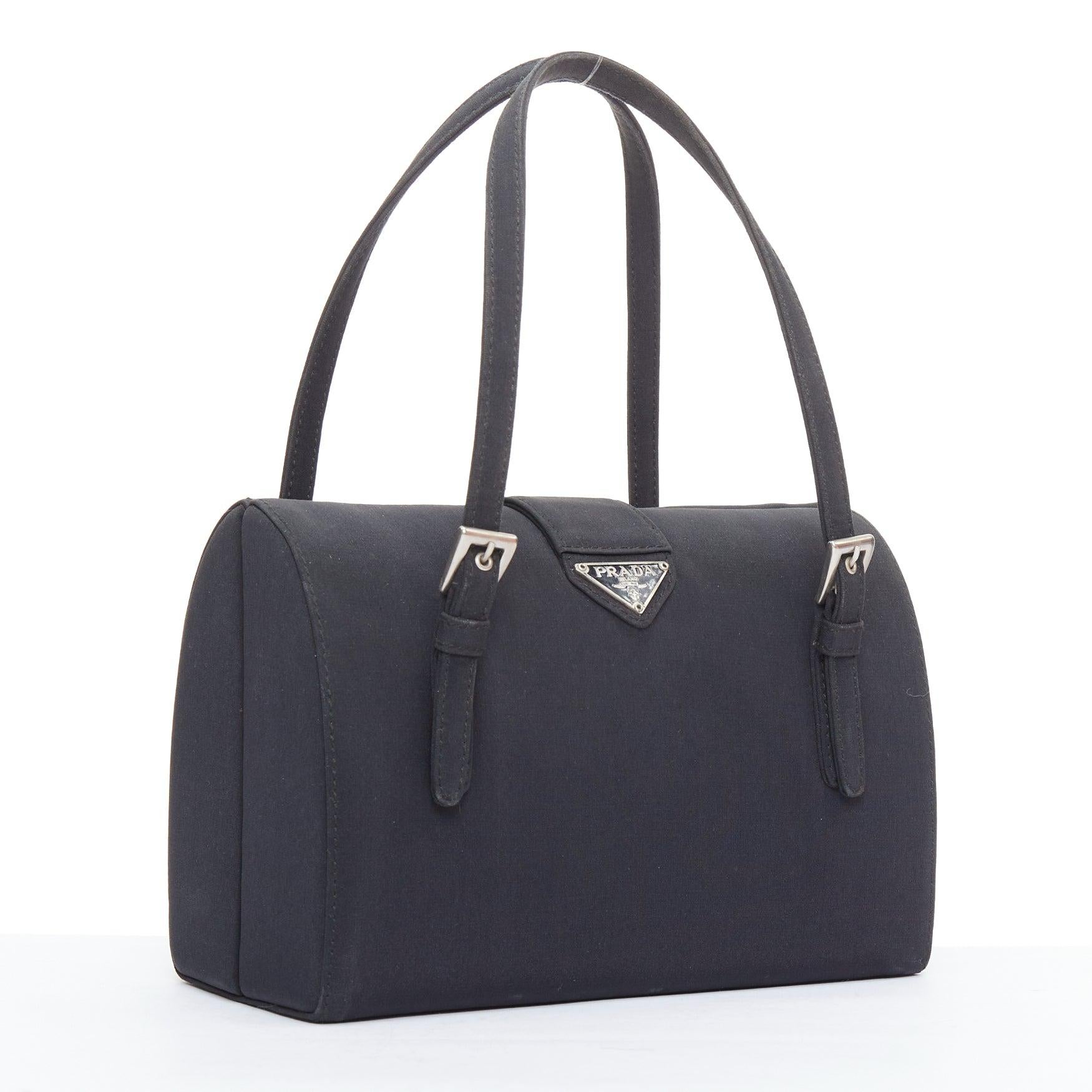 PRADA Vintage black nylon structured silver triangle logo boston box bag
Reference: TGAS/E00588
Brand: Prada
Designer: Miuccia Prada
Material: Satin
Color: Black, Silver
Pattern: Solid
Closure: Magnet
Lining: Black Fabric
Extra Details: Structured