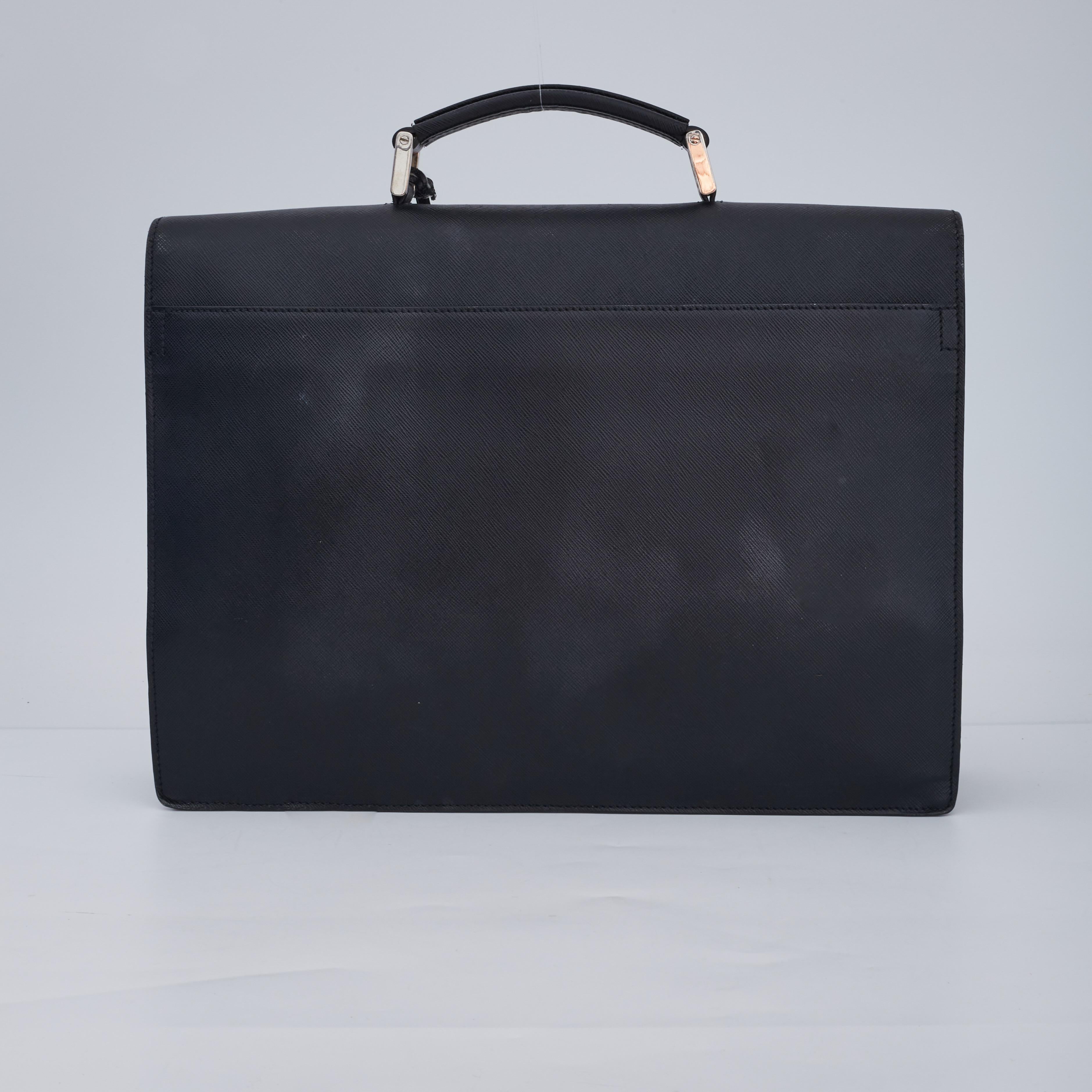 COLOR: Black
MATERIAL: Leather
ITEM CODE: 134
MEASURES: H 11.5” x L 14.97” x D 3.5”
DROP: 2”
COMES WITH: Key attached
CONDITION: Good - light scuff marks to exterior, overall very clean, faint scratches.

Made in Italy