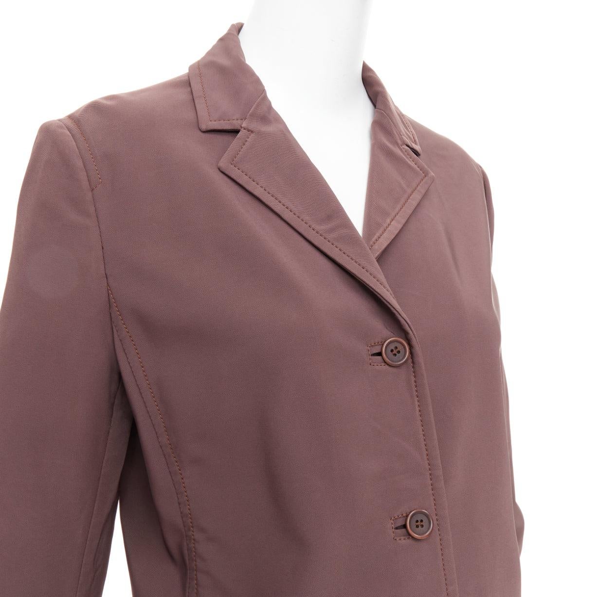 PRADA Vintage brown low sheen twill patch pocket notch lapel jacket IT46 XL
Reference: CNPG/A00109
Brand: Prada
Designer: Miuccia Prada
Material: Polyester, Blend
Color: Brown
Pattern: Solid
Closure: Button
Extra Details: Notch lapels. Double