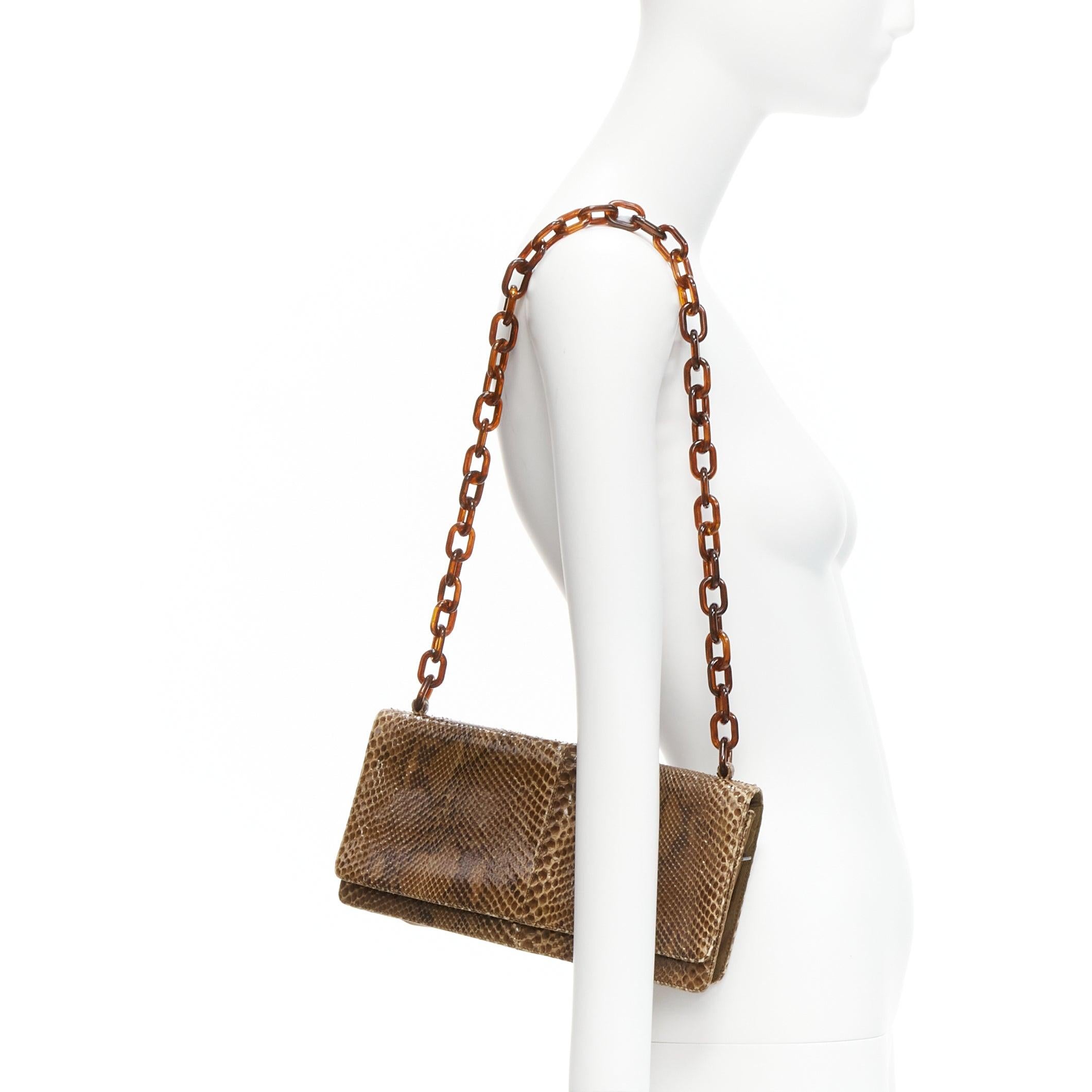 PRADA Vintage glossy brown scaled leather acrylic chain link shoulder bag
Reference: GIYG/A00305
Brand: Prada
Designer: Miuccia Prada
Material: Leather, Acrylic
Color: Brown
Pattern: Animal Print
Closure: Snap Buttons
Lining: Bronze Fabric
Extra