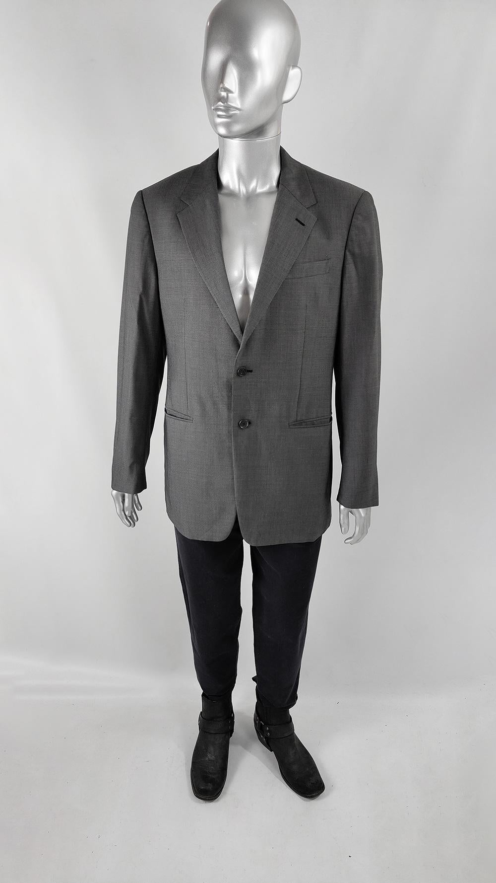 An excellent and sleek vintage mens blazer jacket from the early 2000s by luxury Italian fashion house, Prada. Made in Italy, from a virgin wool and silk fabric with notched lapels and welt pockets giving a minimalist look.

Size: Marked IT 52R