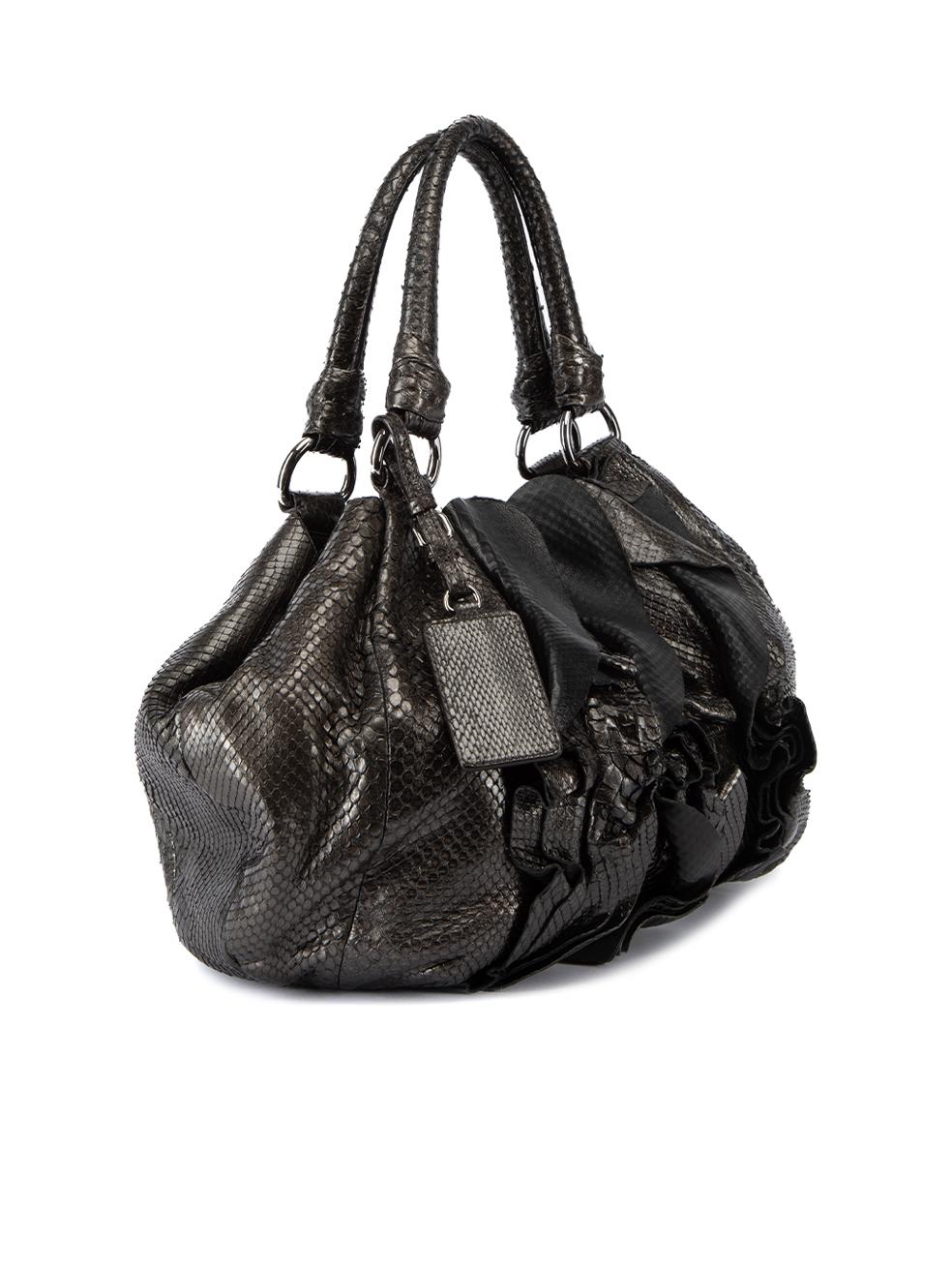 CONDITION is Very good. Minimal wear to bag is evident. Minimal wear to snakeskin leather exterior and bag interior on this used Prada designer resale item. 



Details


Metallic grey

Snakeskin leather

Medium hobo bag

Layered ruffles