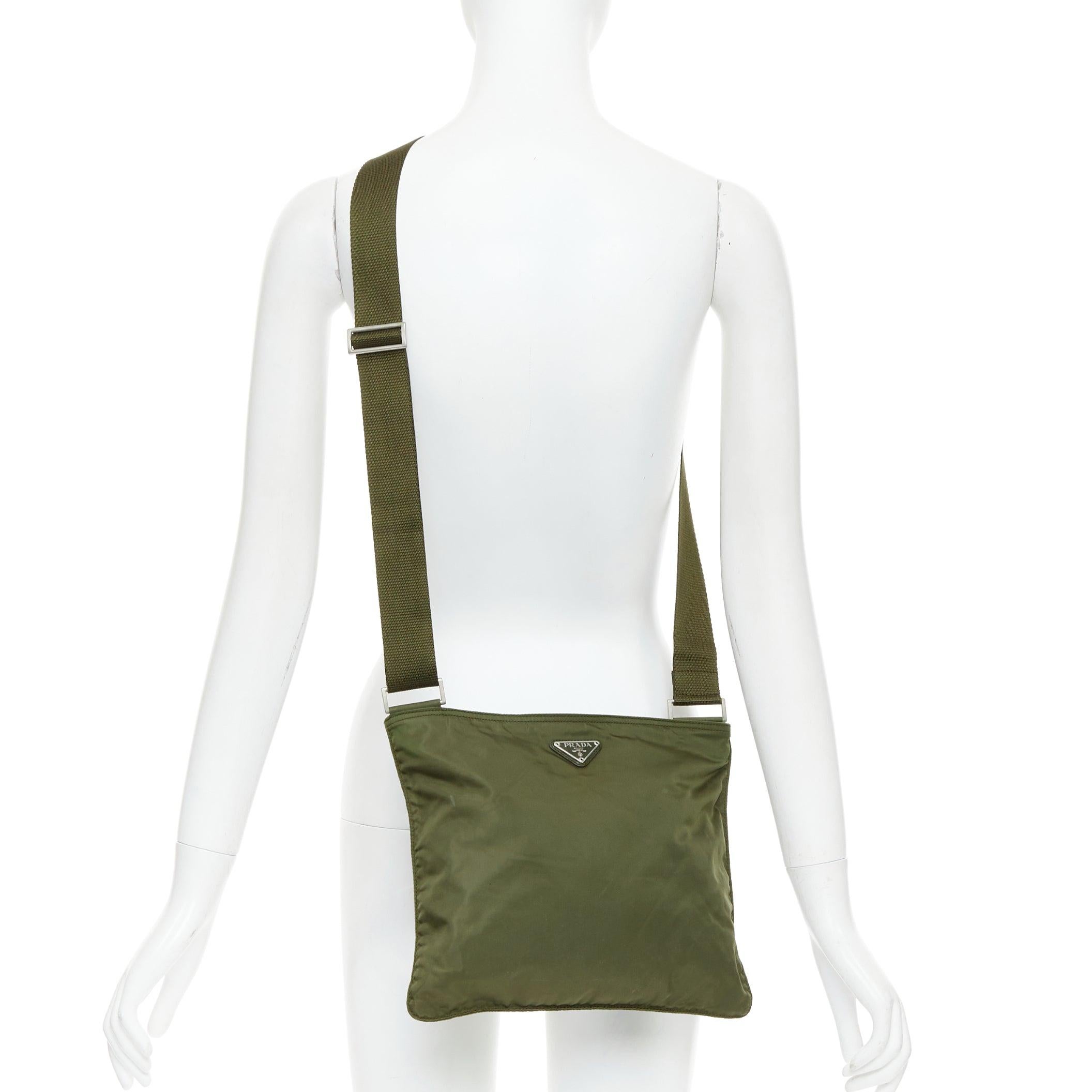 PRADA Vintage navy green nylon triangle logo crossbody bag
Reference: CNPG/A00106
Brand: Prada
Designer: Miuccia Prada
Material: Nylon
Color: Green, Silver
Pattern: Solid
Closure: Zip
Lining: Green Fabric
Made in: Italy

CONDITION:
Condition: Very