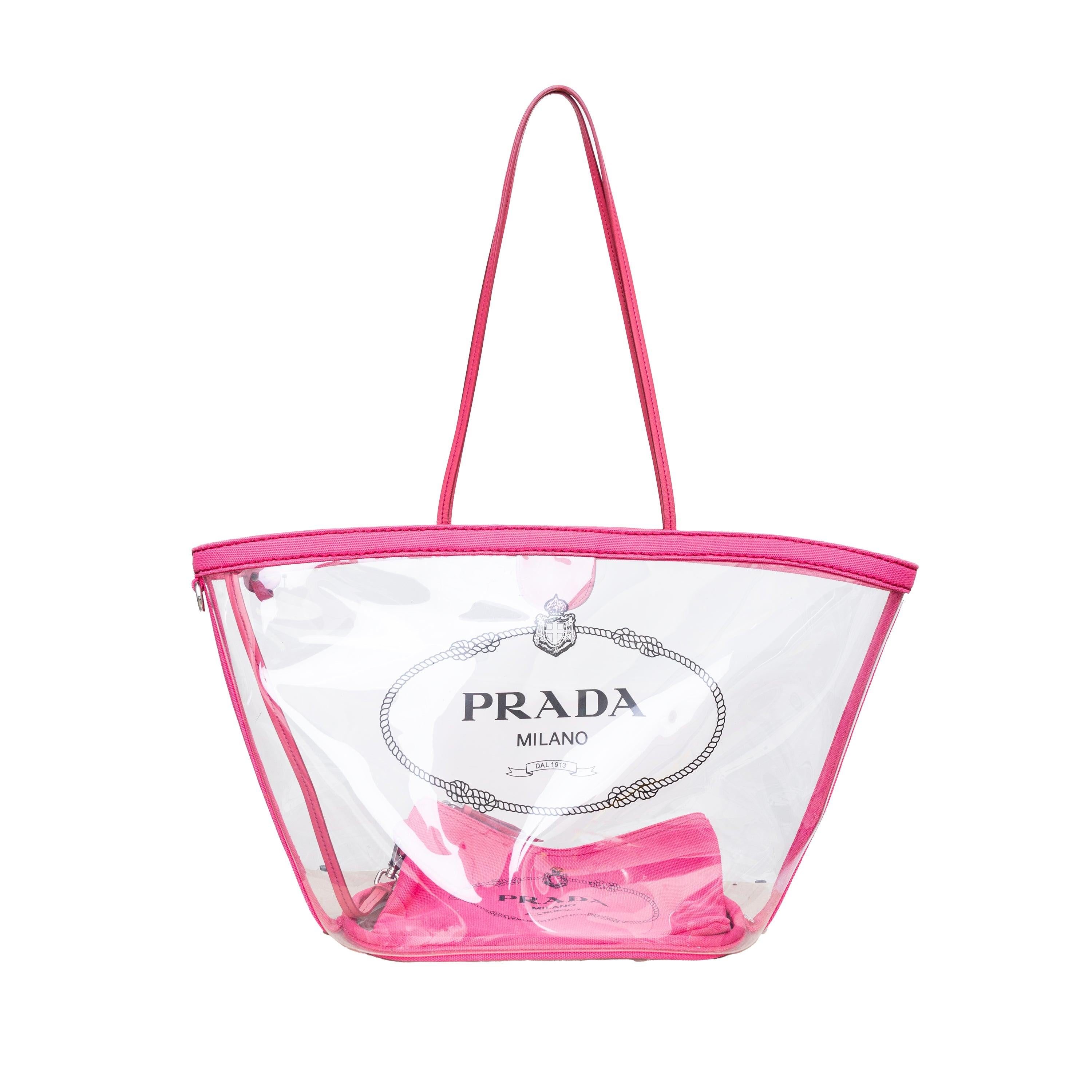 Effortlessly chic and versatile, the Prada Vinyl PVC Tote Bag is a must-have for your summer wardrobe. Made with transparent vinyl and accented with pink canvas trimming, it features the iconic Prada logo and two leather handles. Plus, it comes with