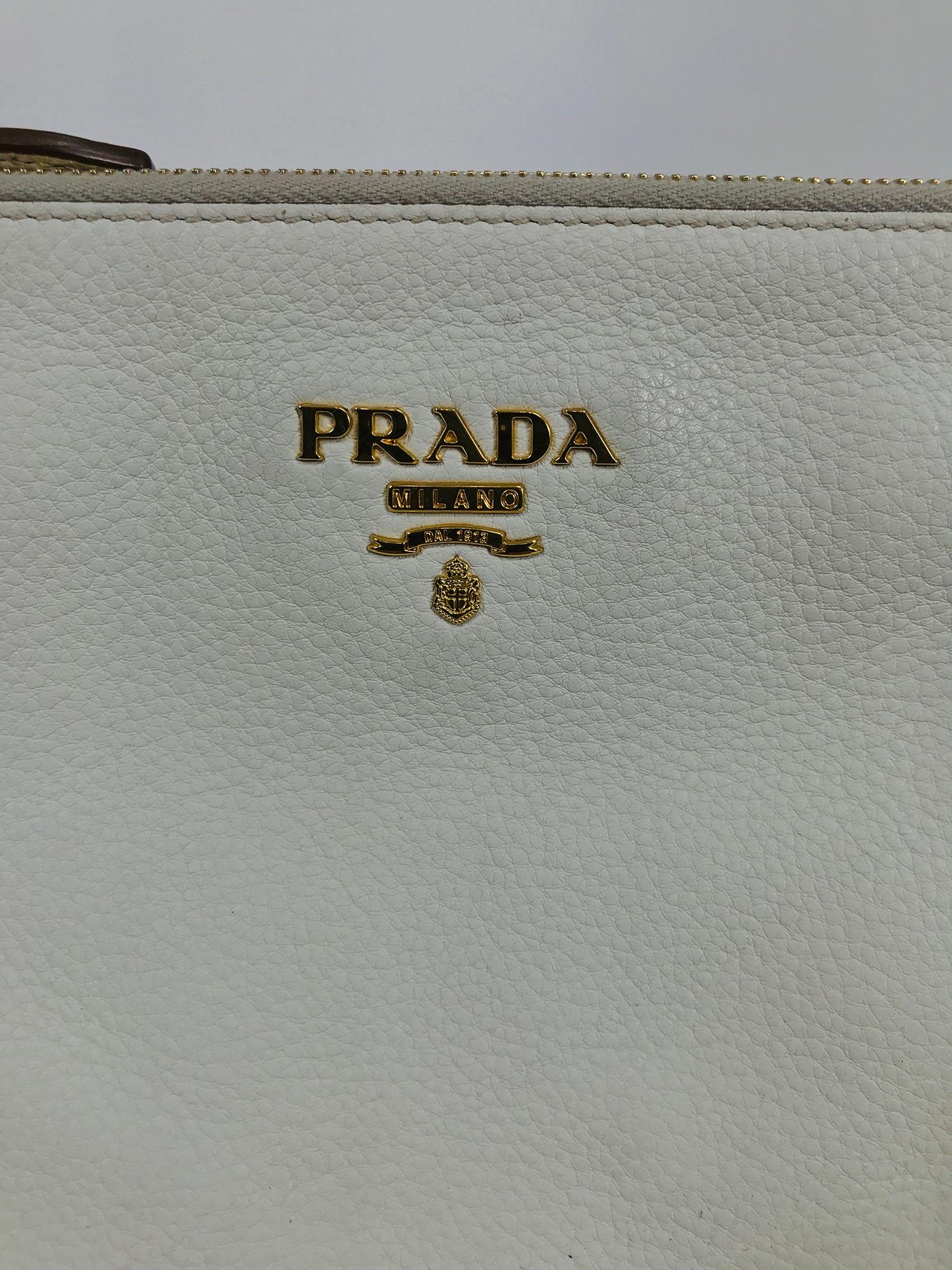 Vitello Daino double compartment leather cross body bag in off white pebble leather, with gold hardware. This beautiful bag retails for $1400. This bag is in very good pre owned condition with a very little wear to the bottom edges, see photos. Bag