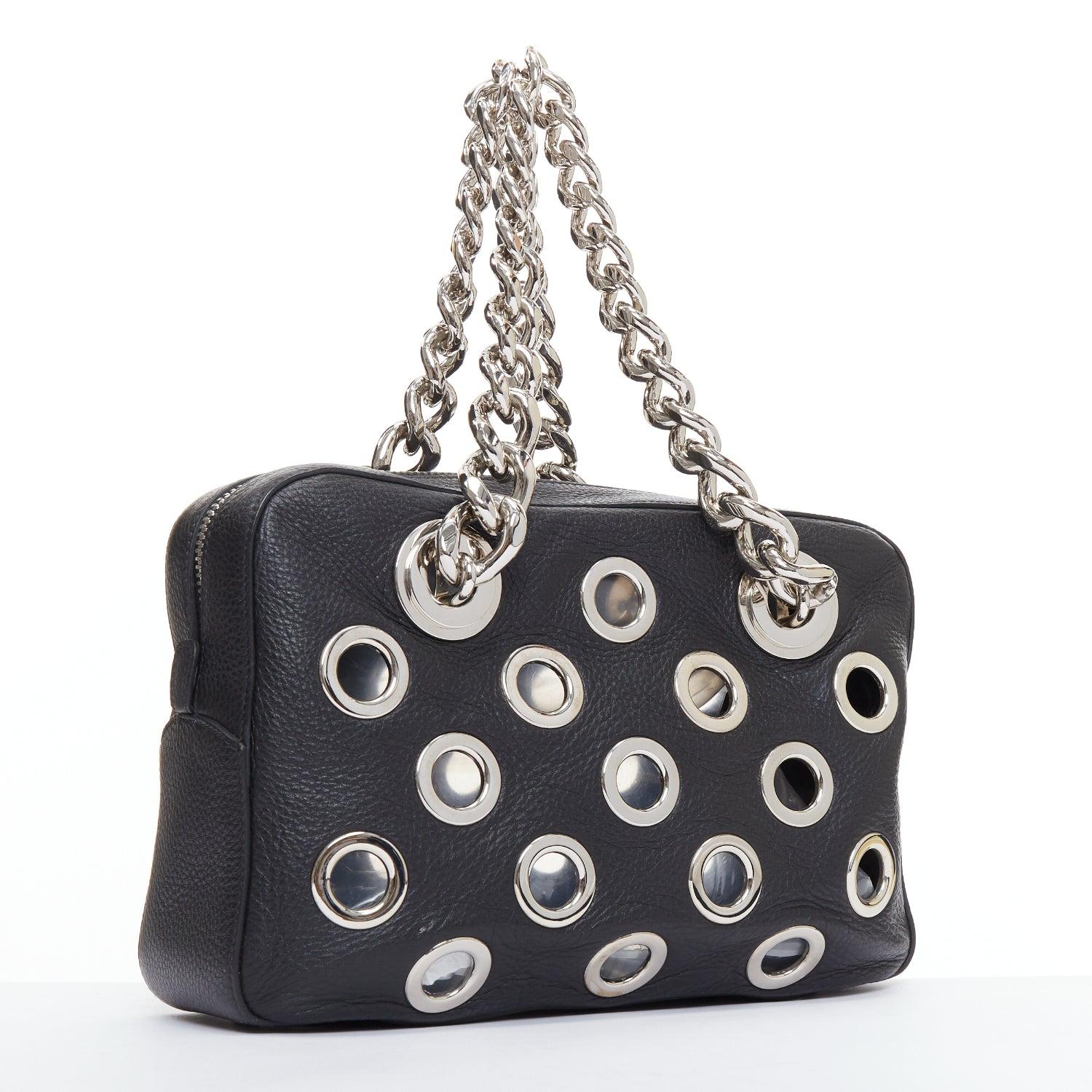 PRADA Vitello Daino Grommet Chain black leather silver cut out rectangle shoulder bag
Reference: TGAS/E00080
Brand: Prada
Designer: Miuccia Prada
Model: Vitello Daino Grommet
Material: Leather, Metal
Color: Black, Silver
Pattern: Solid
Closure: