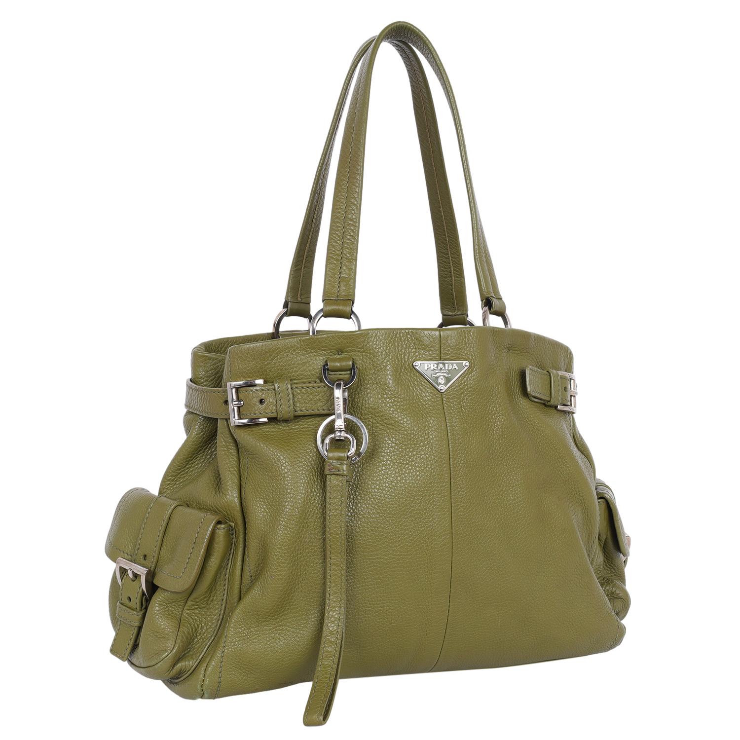 Authentic, pre-owned Vitello Daino Life Shoulder Bag in olive green leather. Features olive green leather, long leather shoulder straps, Prada decal on the front of the bag, side buckle pockets, open top closure, large deep interior with two sides,